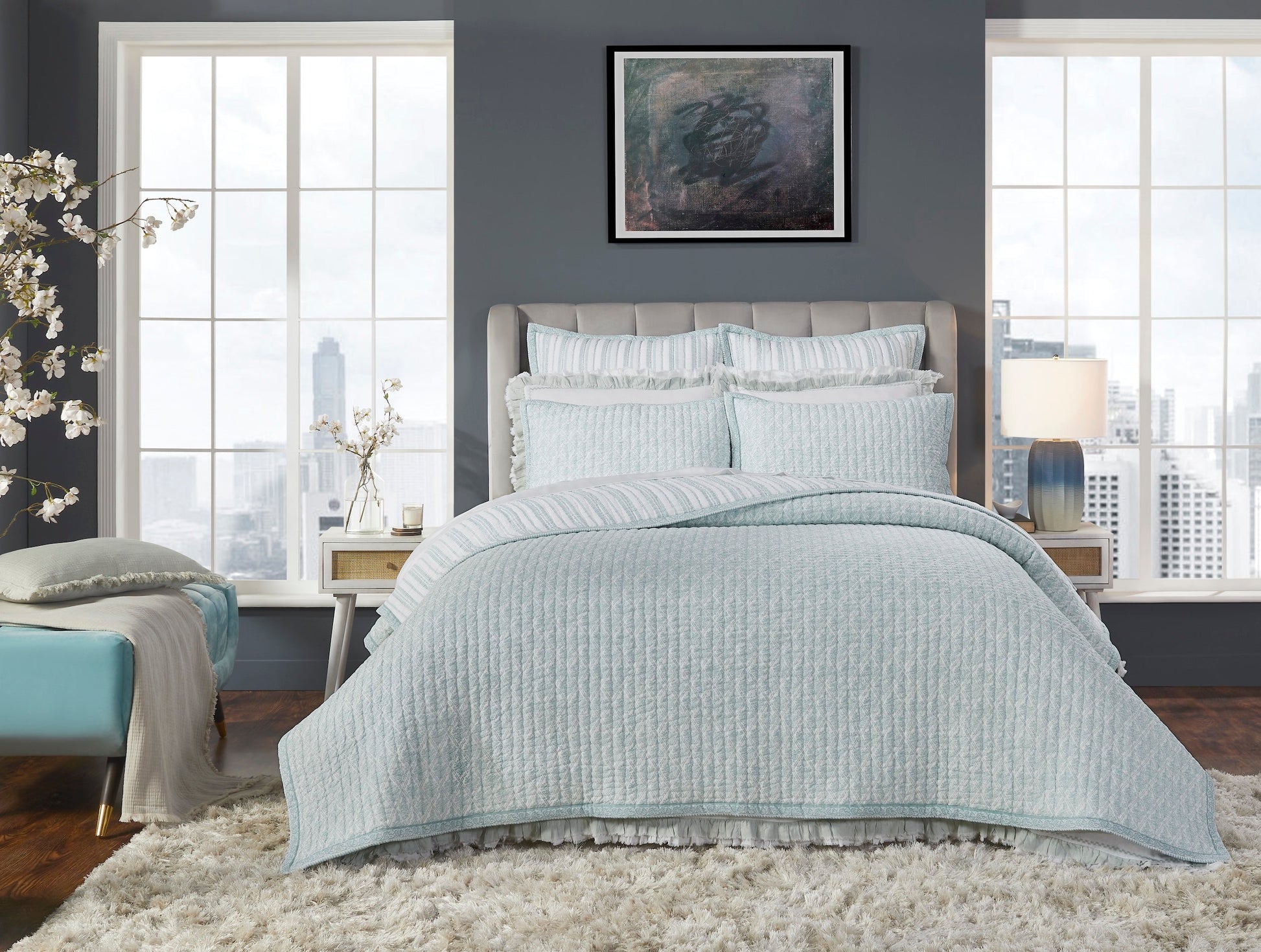 QT-347-11096_1|Elegant bedroom showcasing a full blue patterned quilt set, including a textured quilt and ruffled shams, for a luxurious feel.