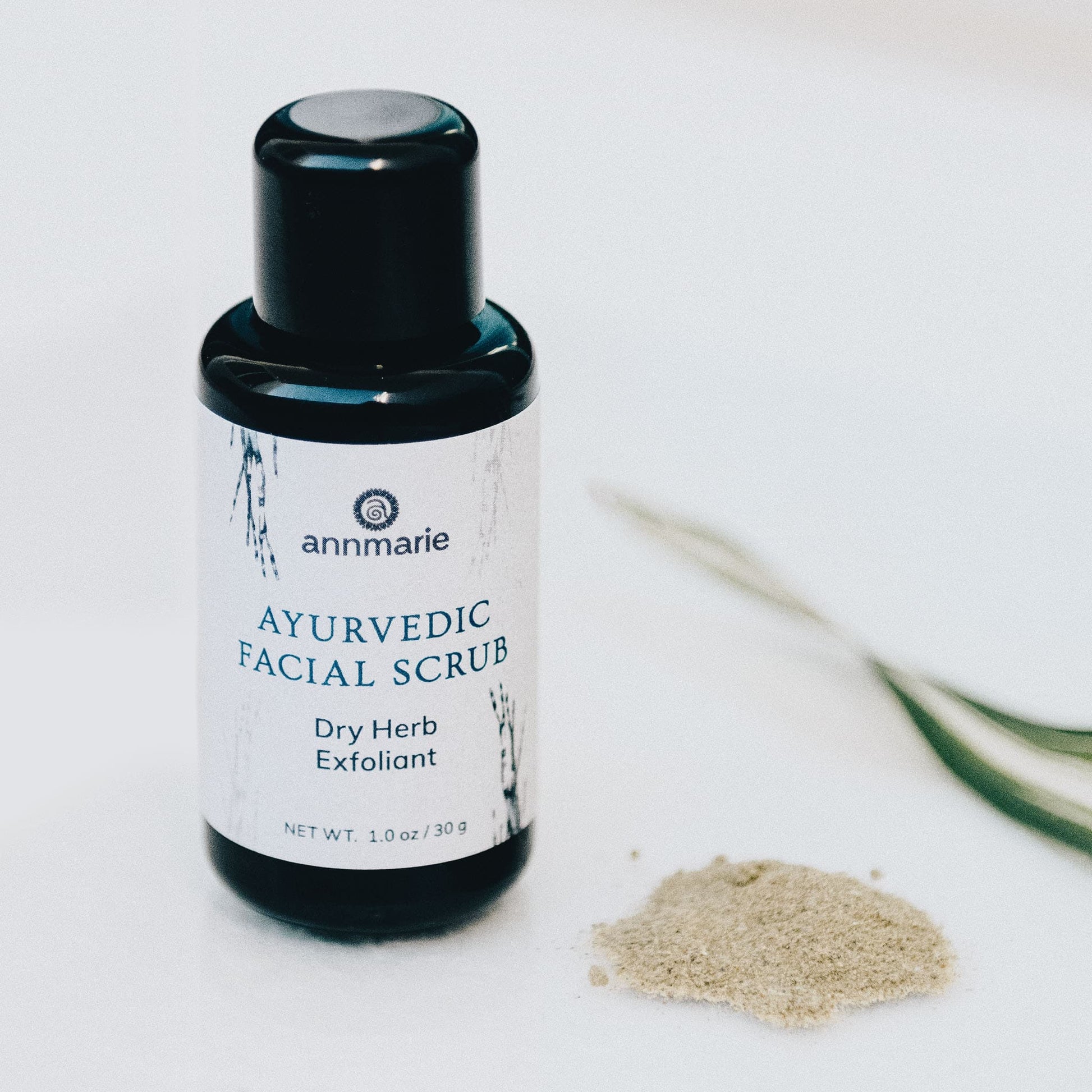 Annmarie Ayurvedic Facial Scrub dry herb exfoliant bottle with herbal powder used for gentle natural facial exfoliation.
