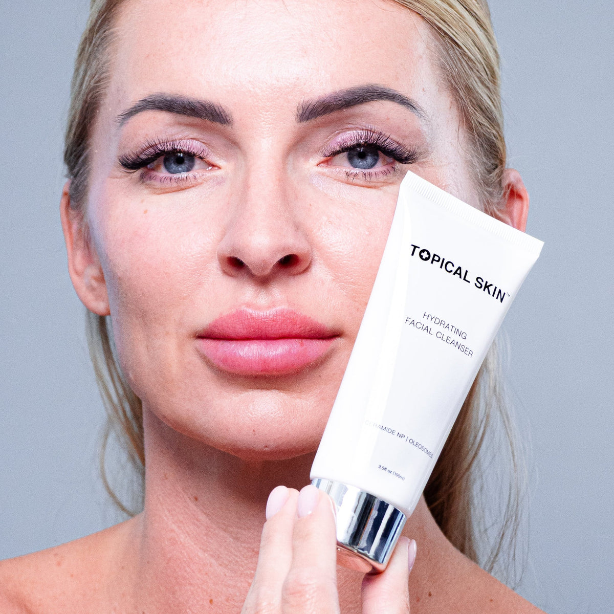 Hydrating Facial Cleanser with Oleosomes TOPICAL SKIN Dermaceuticals facial cleanser in white tube with oleosomes hydration.