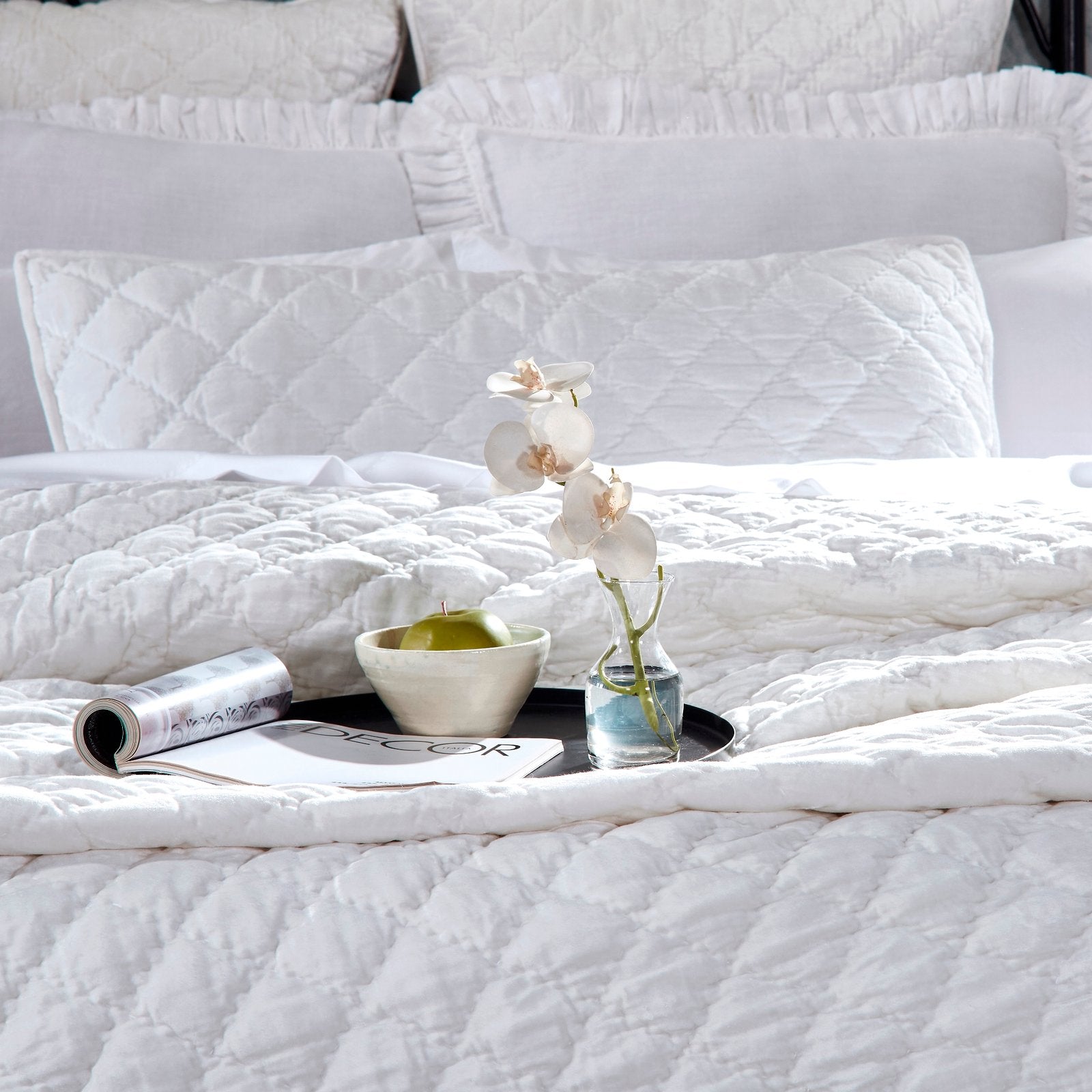 QT-343-9496-LOT1_4|Close-up of a crisp white quilted bedspread featuring a detailed diamond stitch pattern. Elegant, clean, and inviting bedding.