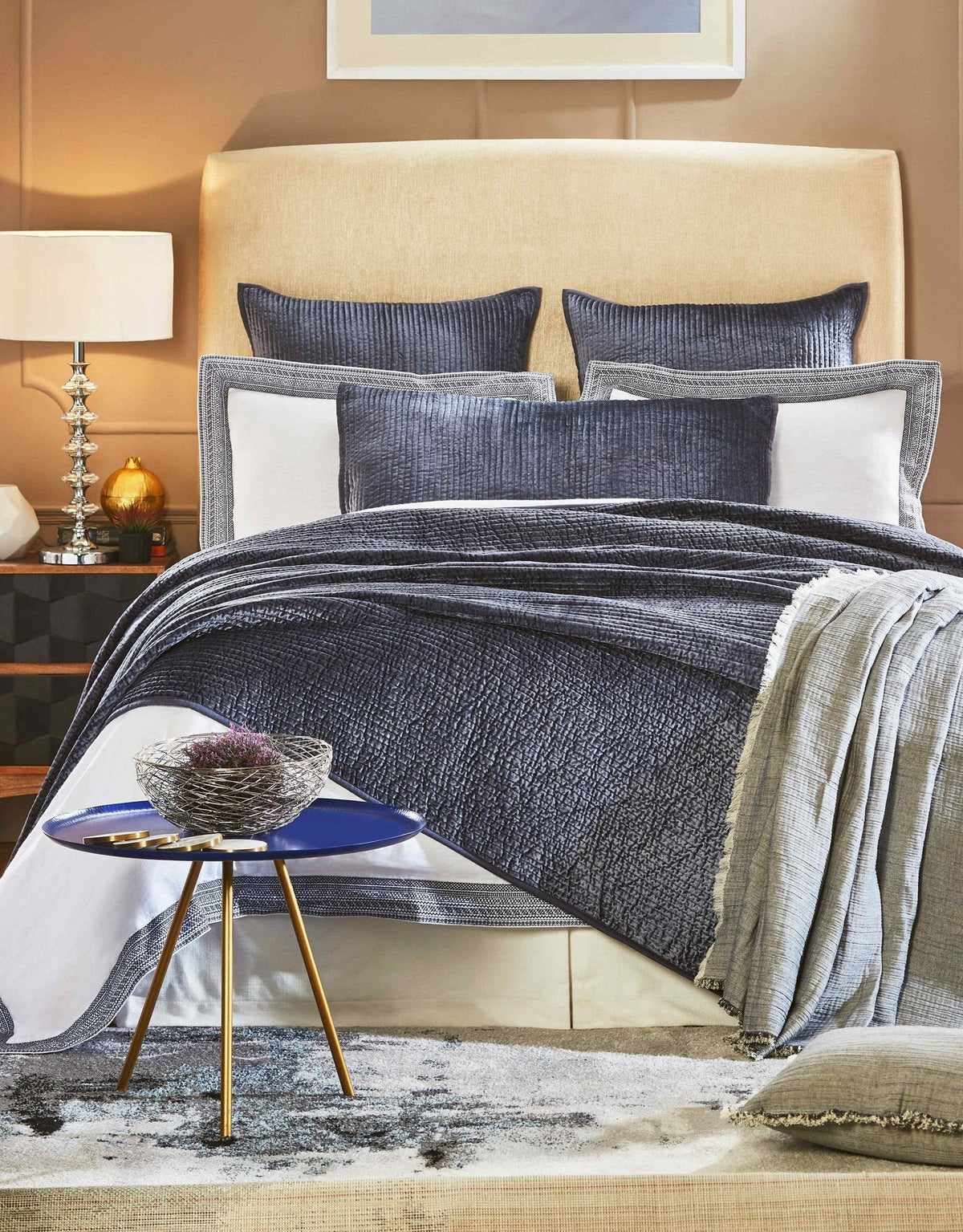 CL-159-11096_1|Stylish navy textured coverlet elegantly draped on a bed, offering a rich, comforting layer and sophisticated bedroom appeal.