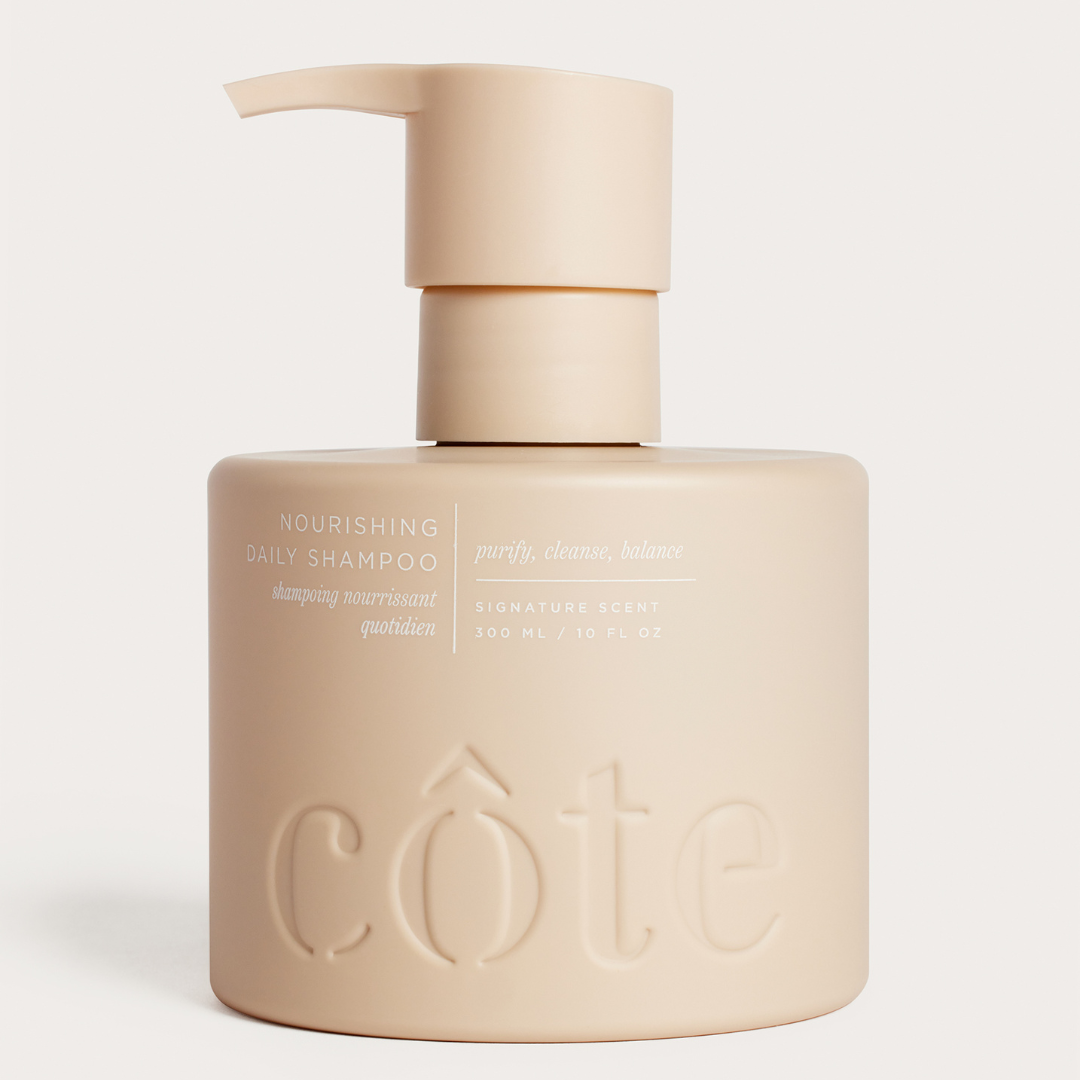 Bottle of Côte Beauty Nourishing Daily Shampoo Non-Toxic Sulfate-Free Hair Cleanser.