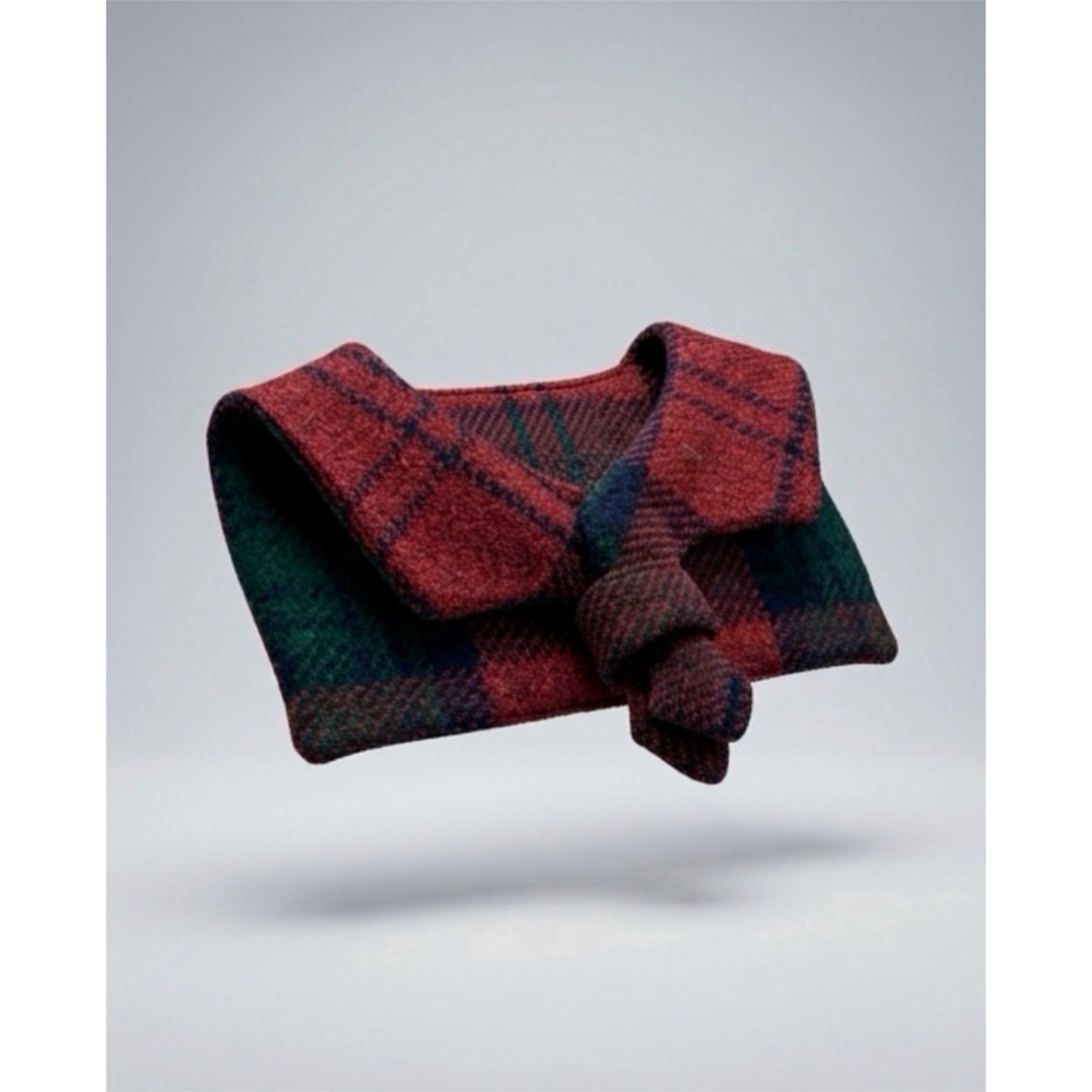 Wool Red and green plaid fabric with a sailor collar on a light gray background