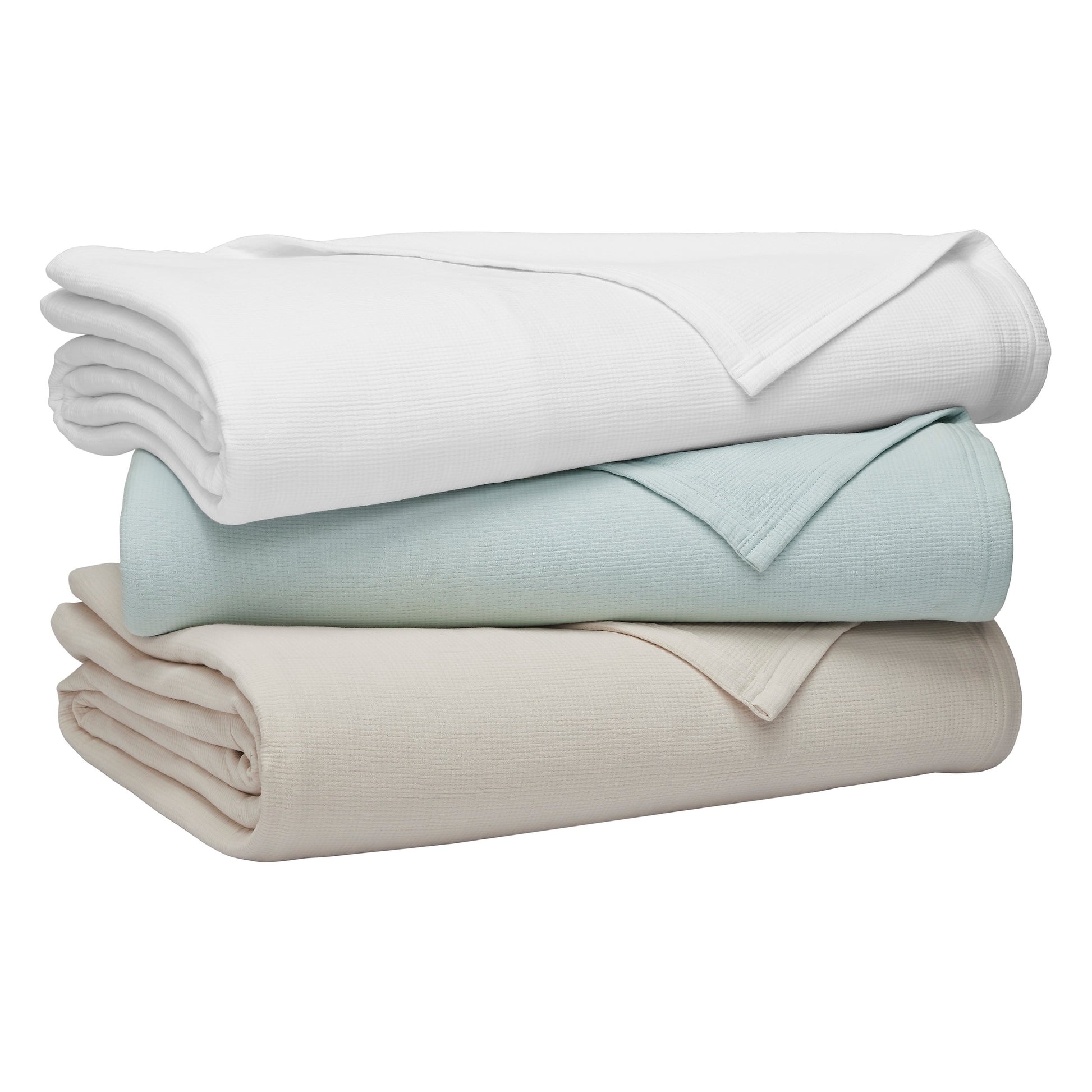 BL-859-11096_10|Stack of three folded waffle weave blankets in white, light blue, and cream. Soft, breathable cotton for cozy layering and versatile use.