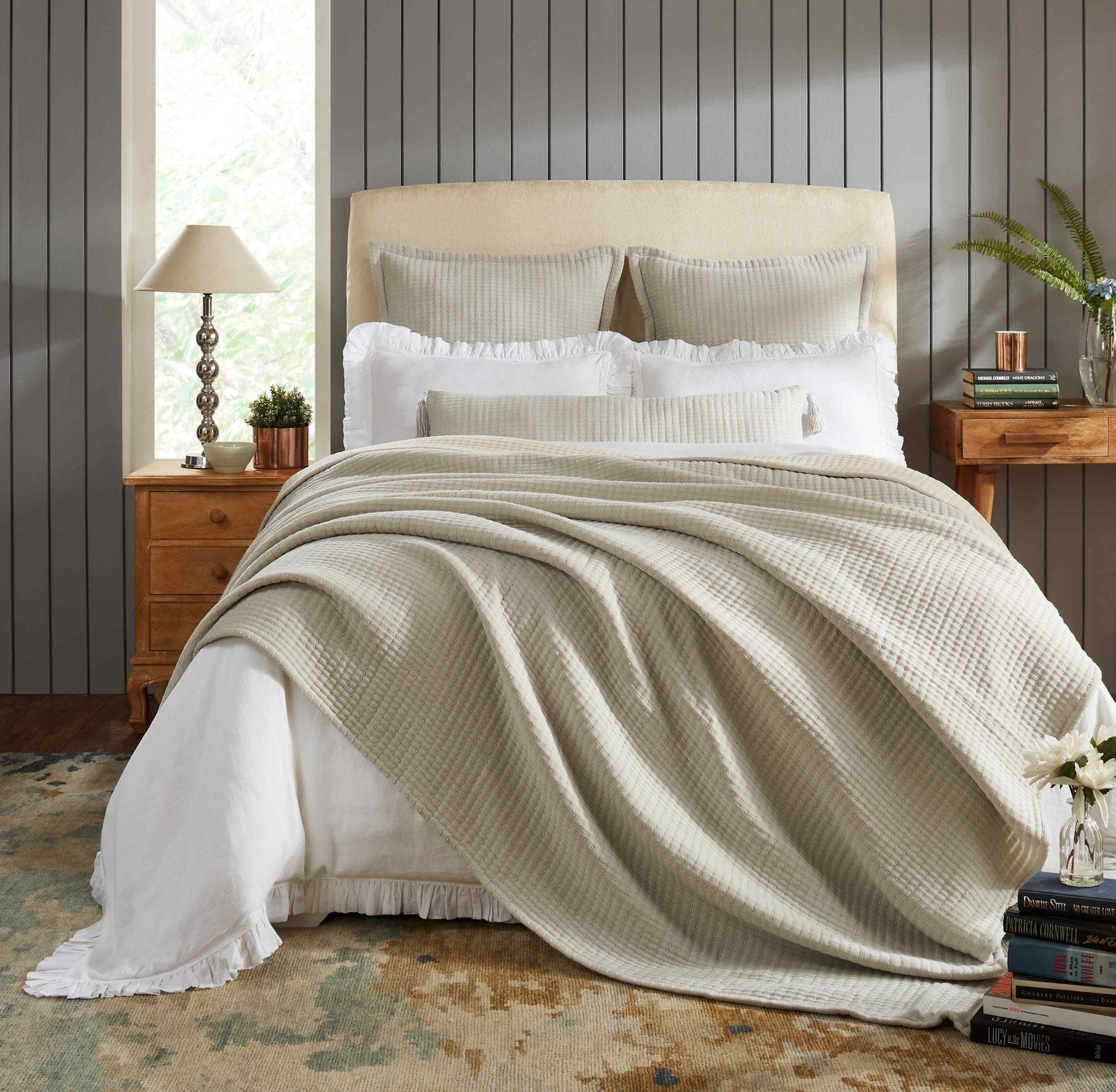 BT-107-11096_4|Cozy beige textured reversible quilt blanket elegantly draped over a bed with white sheets, perfect for inviting bedroom decor.