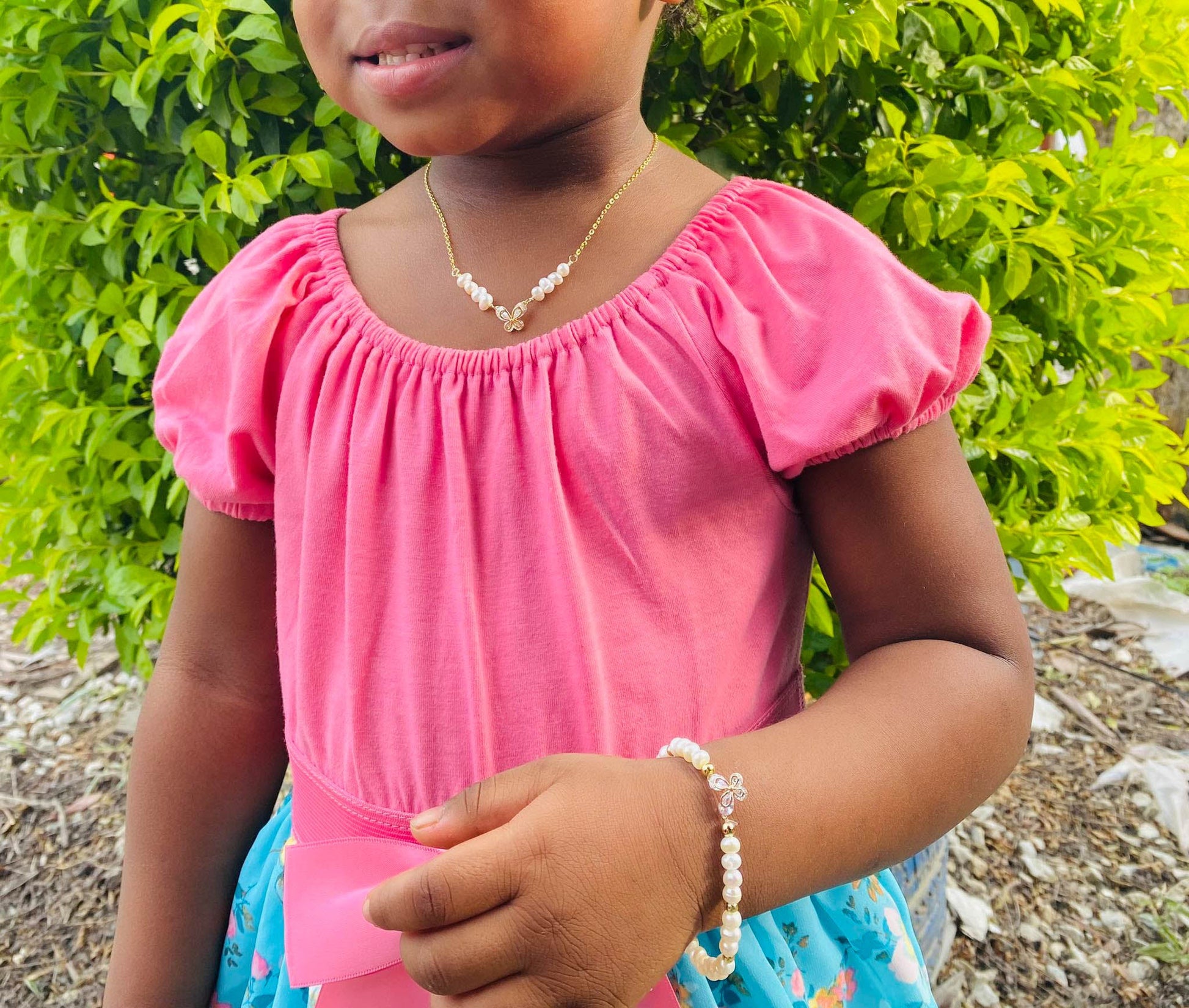 Pearl gold butterfly bracelet modeled