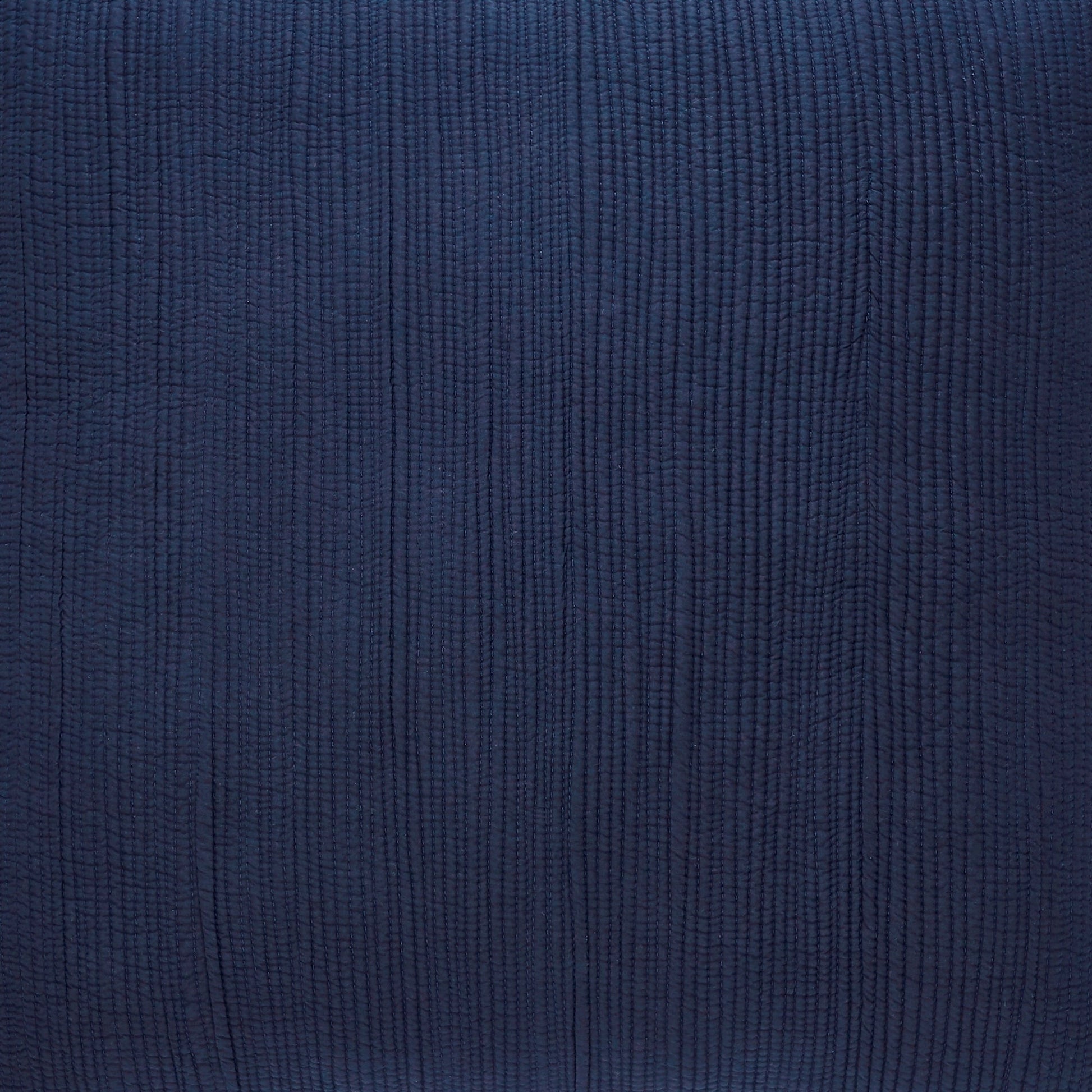 KS-167-2036-LOT1_3|Close-up of elegant navy blue quilted ribbed coverlet fabric, luxurious bedding material for a modern bedroom.