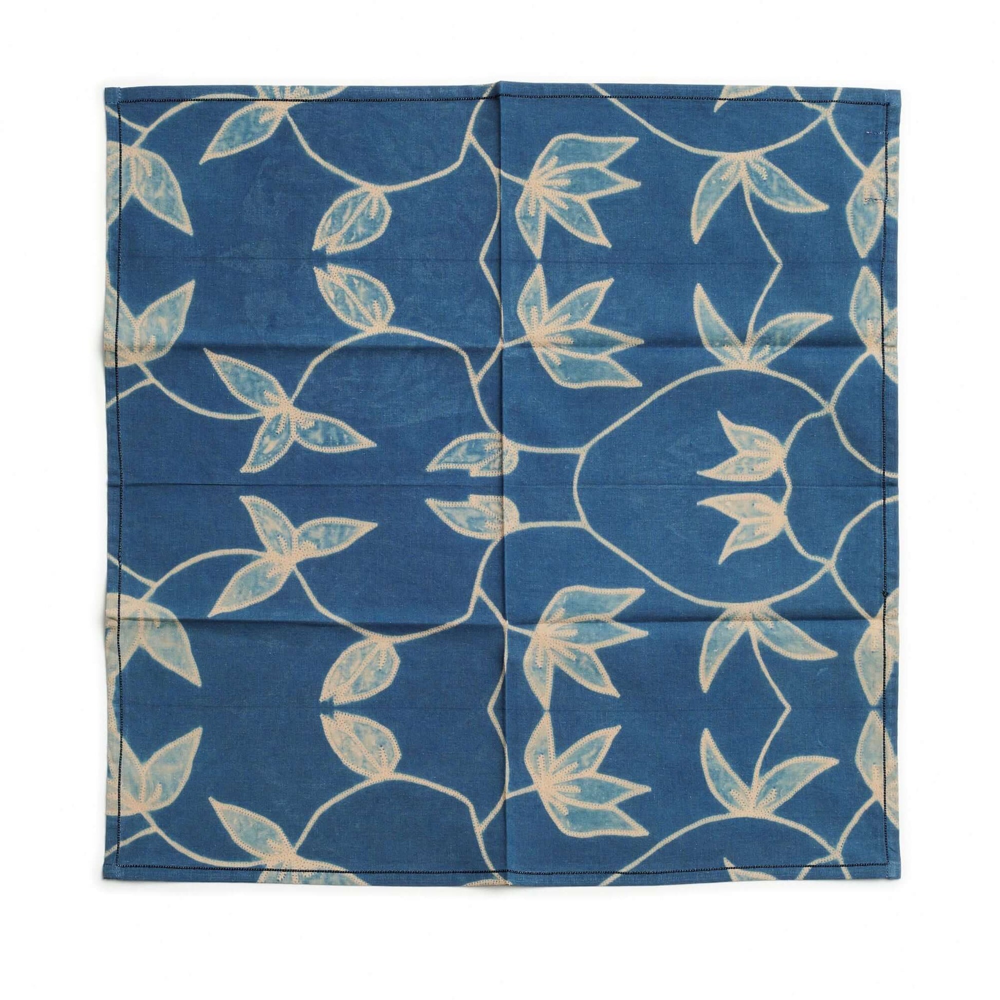 Folio Indigo Handcrafted Shibori Cotton Table Napkins ( set of 4 ) showcasing unique shibori pattern on rich indigo fabric.