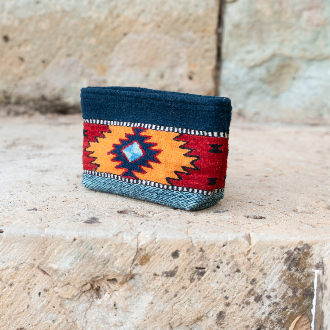 Handwoven pouch with abstract Zapotec arrow design in bold colors featuring internal pocket; perfect for makeup, wallet, or daily essentials.