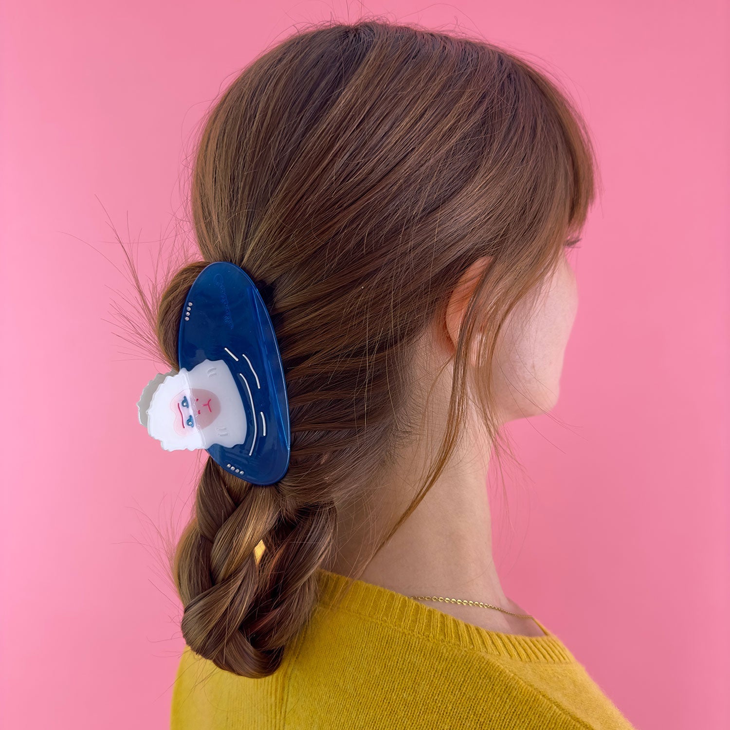 Teeth of blue snow monkey hair claw on blue background.