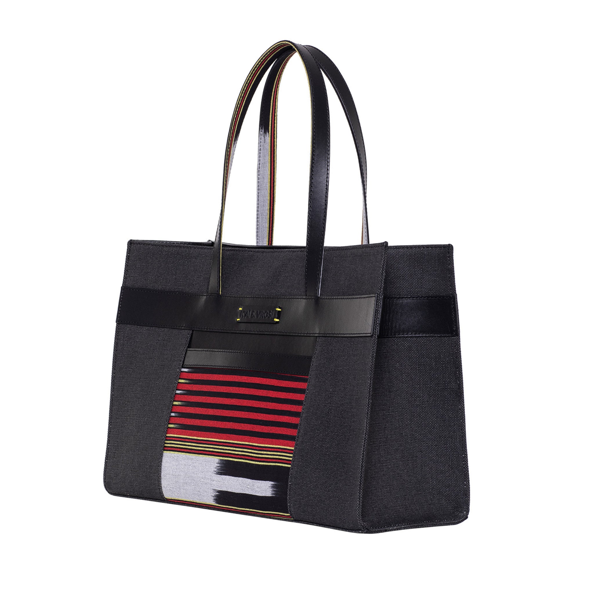 Zua black tote bag. Leather detailings on the body, leather hand strap, canvas on the body and handwoven fabric pocket in the front