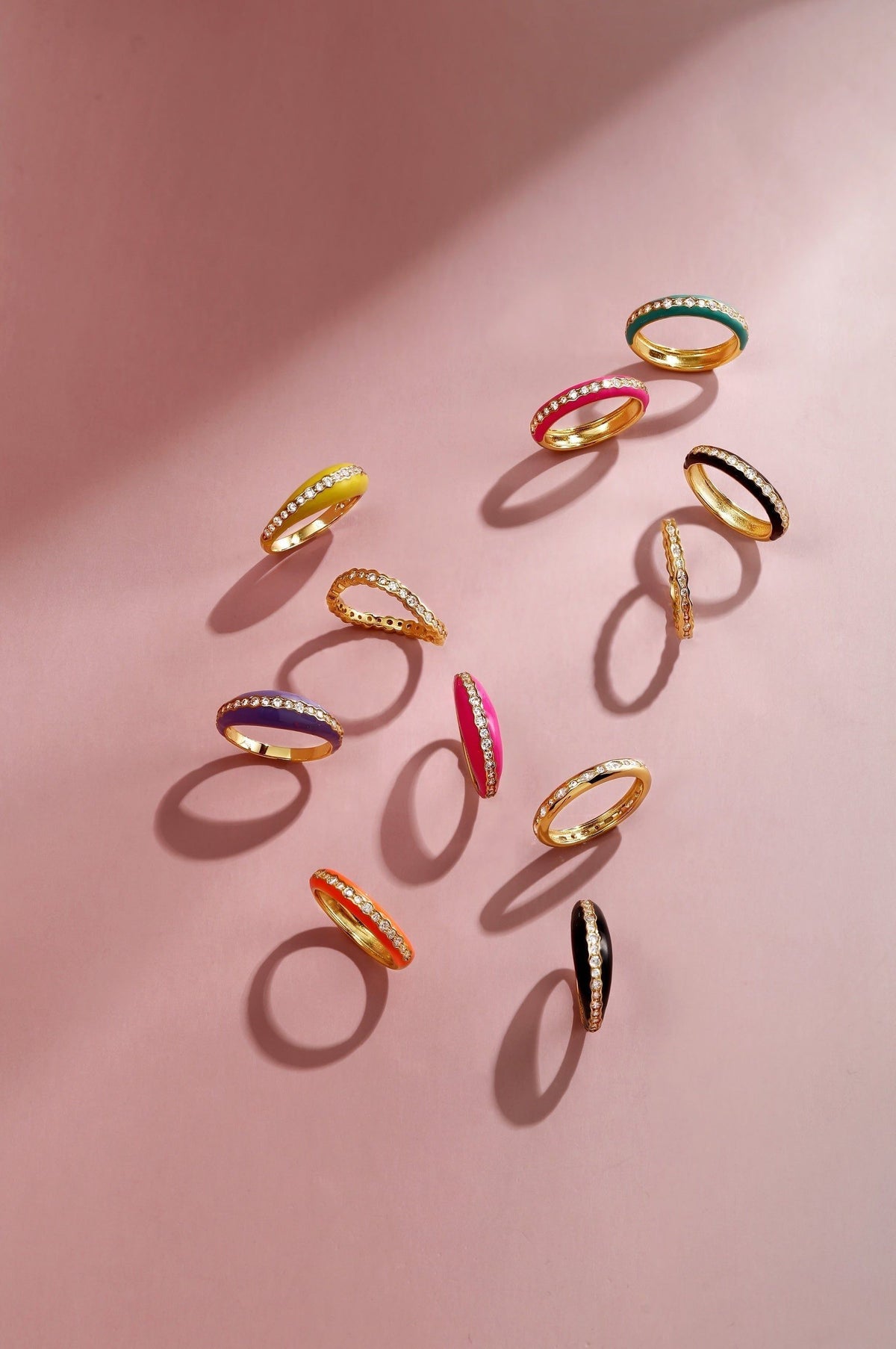 Colorful enamel and diamond rings in a Thin Black Enamel and CZ Channel Ring display