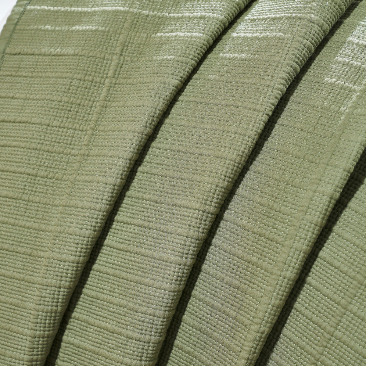 CL-270-11096_8|Folded sage green coverlet showcasing its breathable woven texture. Lightweight blanket for versatile use and warmth.