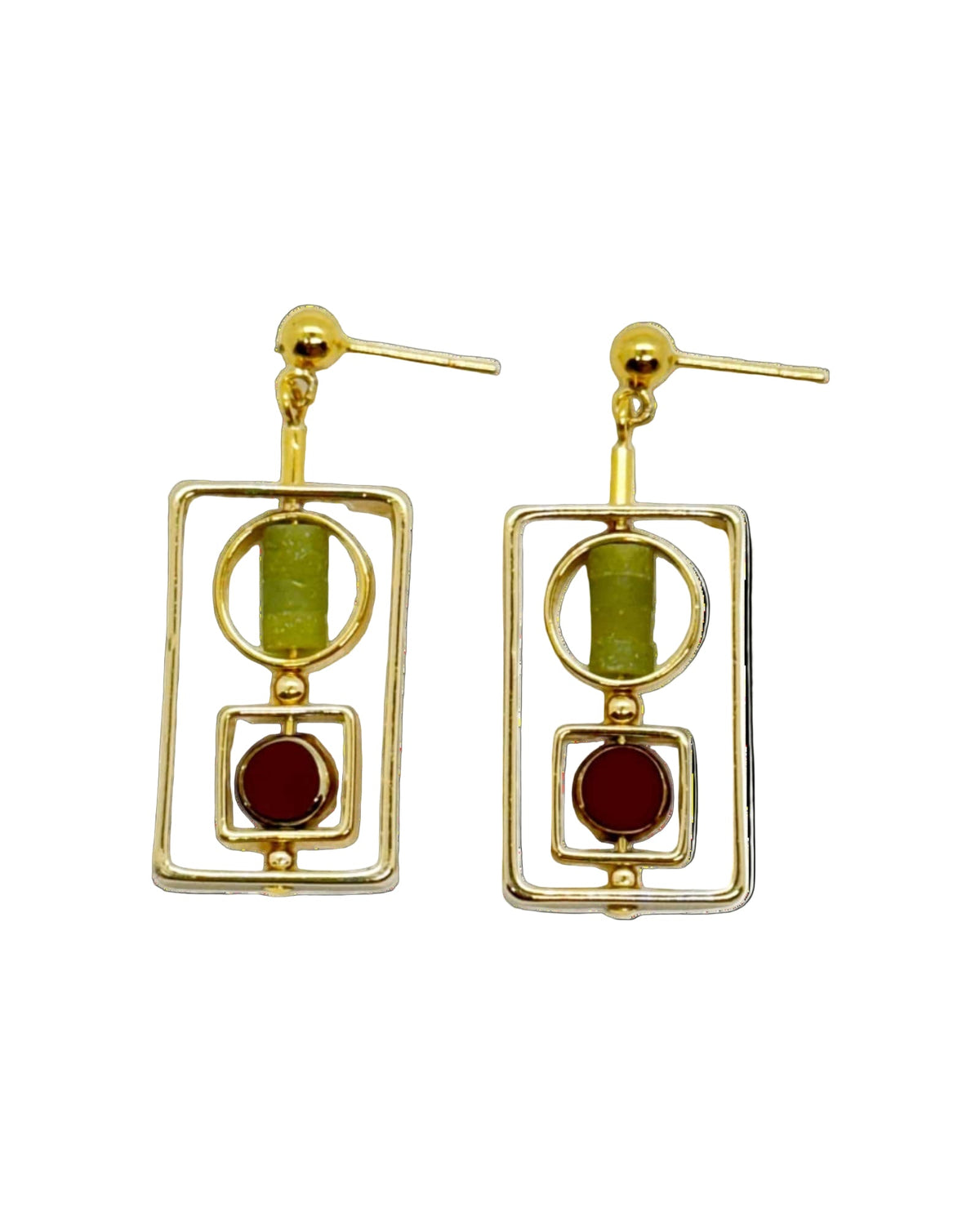 Gold-framed earrings with green and red stones on a white background
