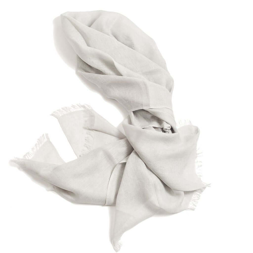Pebble Light Gray Hand Woven Soft Linen Scarf elegantly styled on a white background with soft texture and fringed edges.