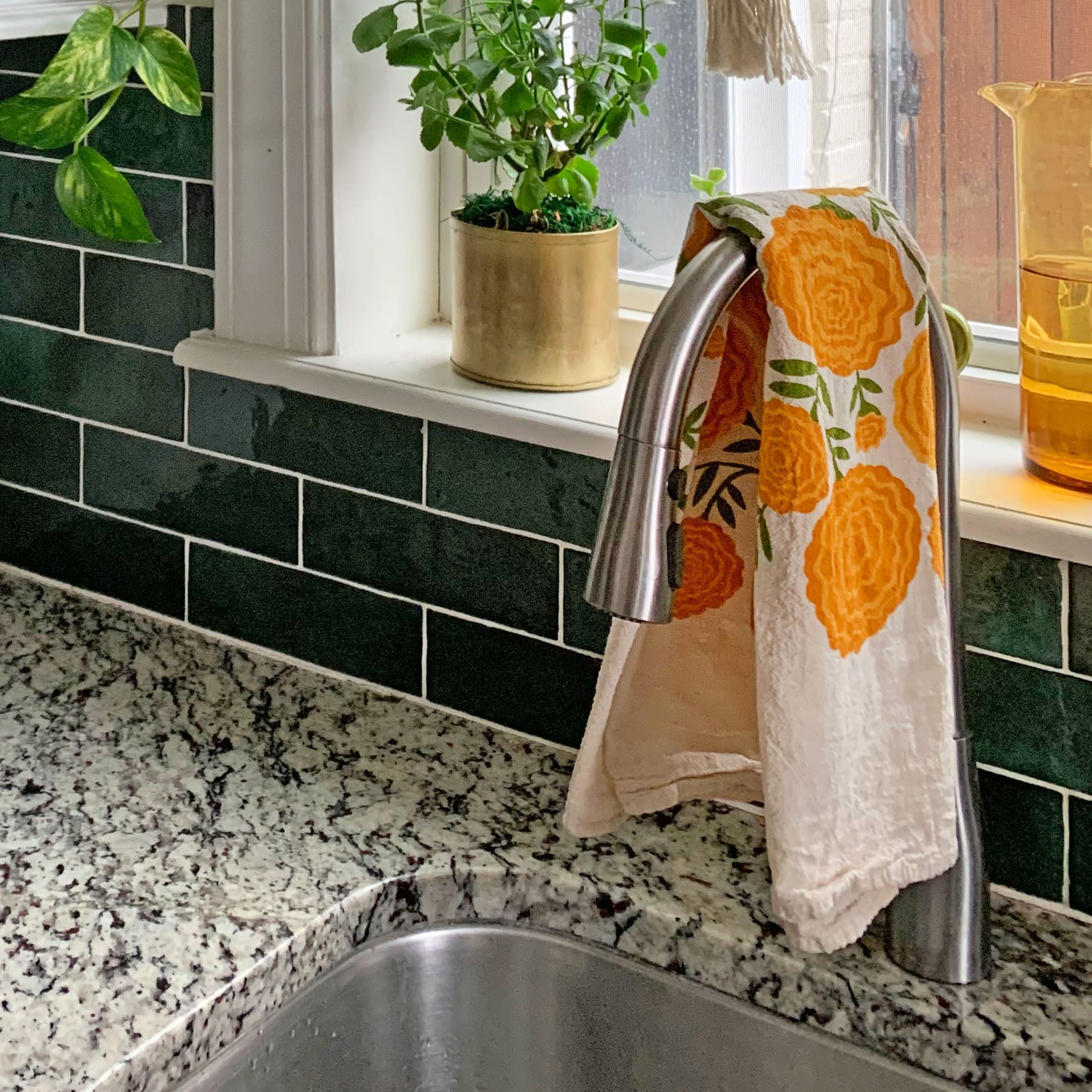Cotton dish towel with marigolds design
