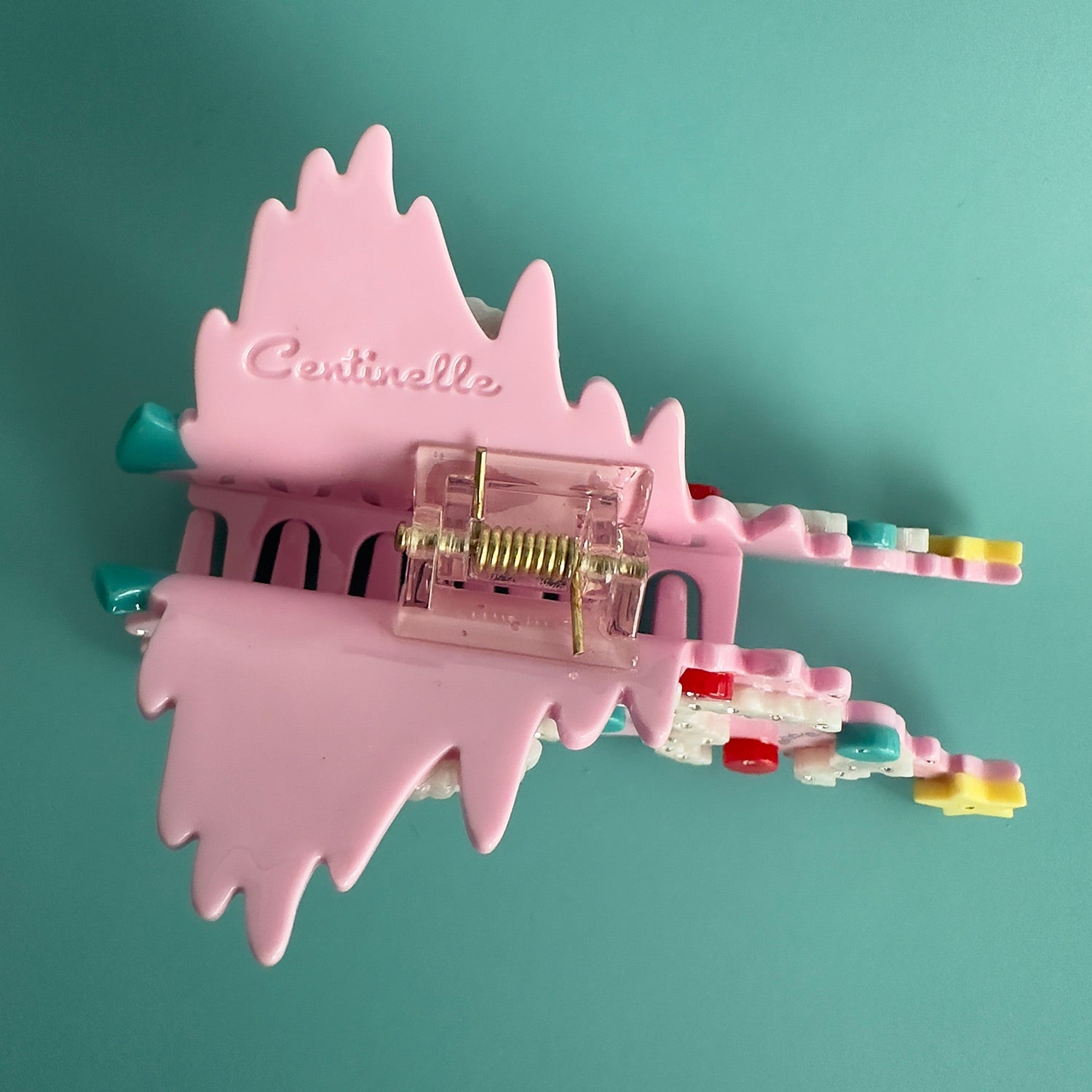 Pink Christmas tree hair claw with festive decorations in blue and red, yellow star and crystals 