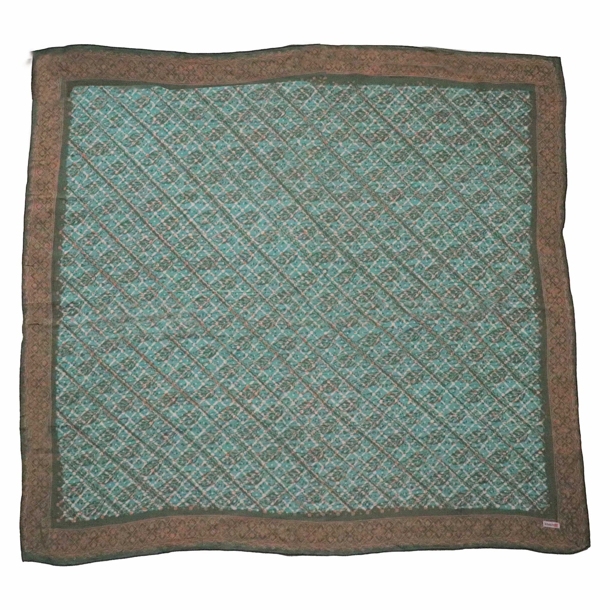 Green and brown patterned bandana square on a white background