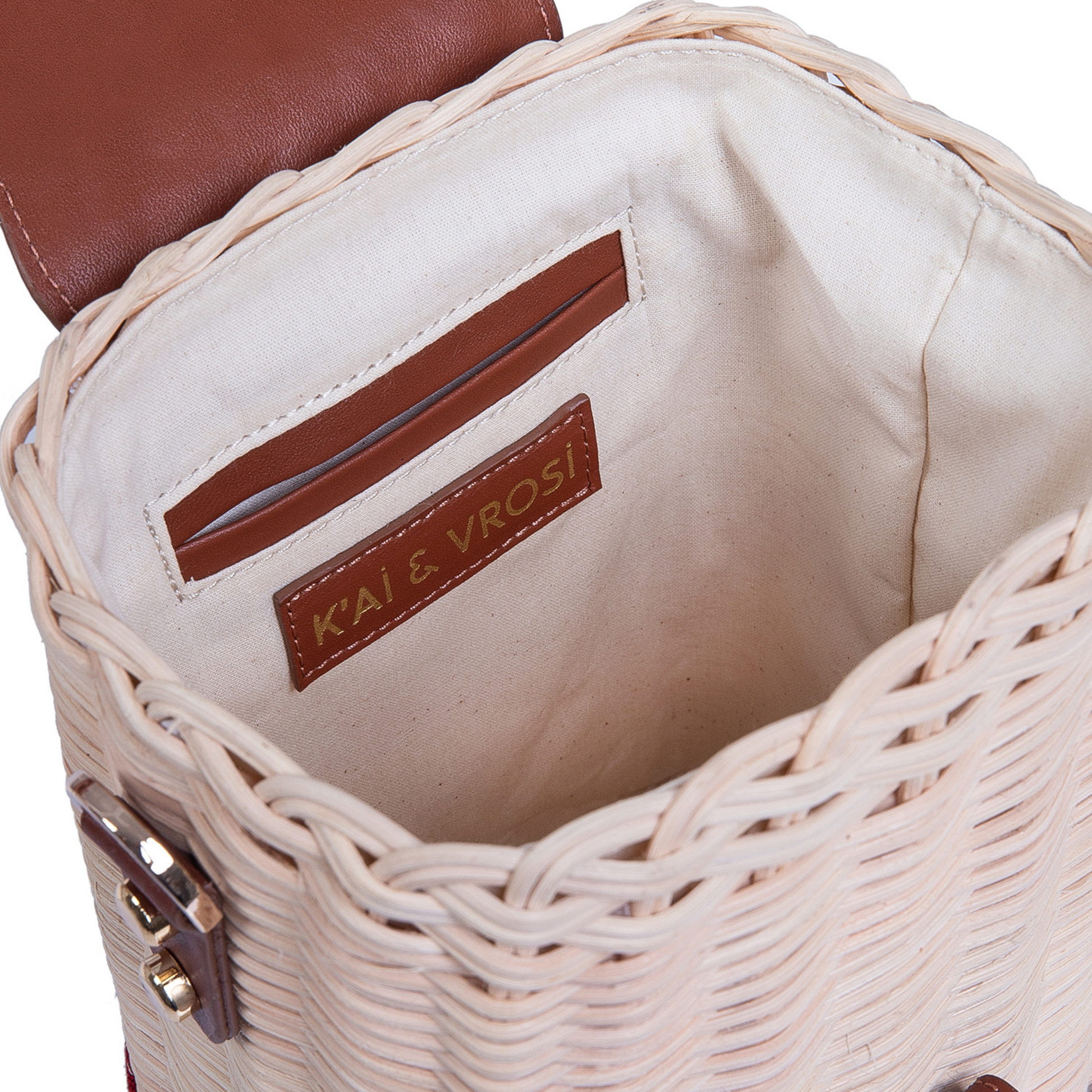 woven rattan basket as the body and brown leather and striped fabric patterns as details