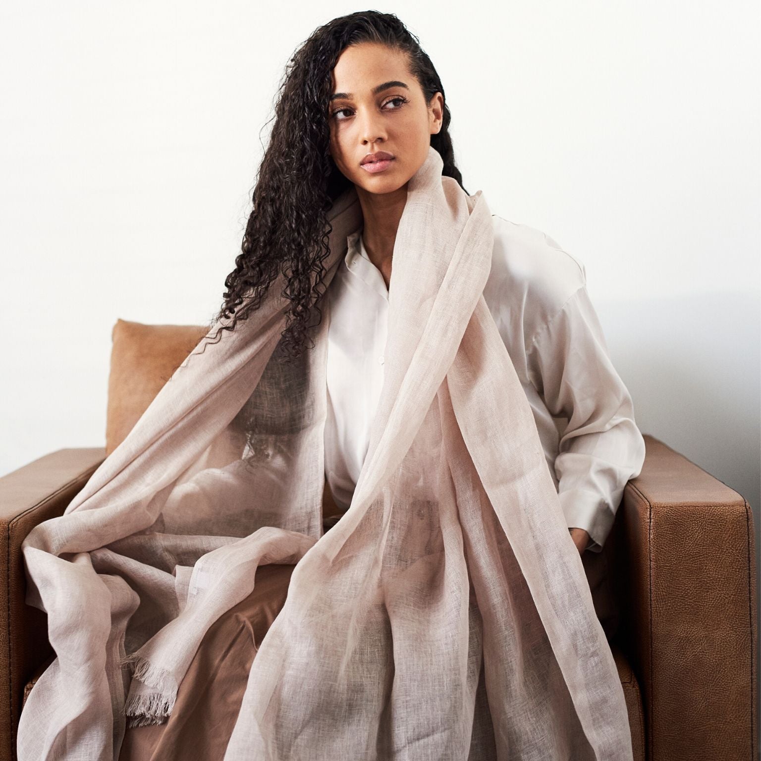 Oat Beige Neutral Hand Woven Soft Linen Silk Scarf styled on a model, showcasing its elegant and translucent appeal.