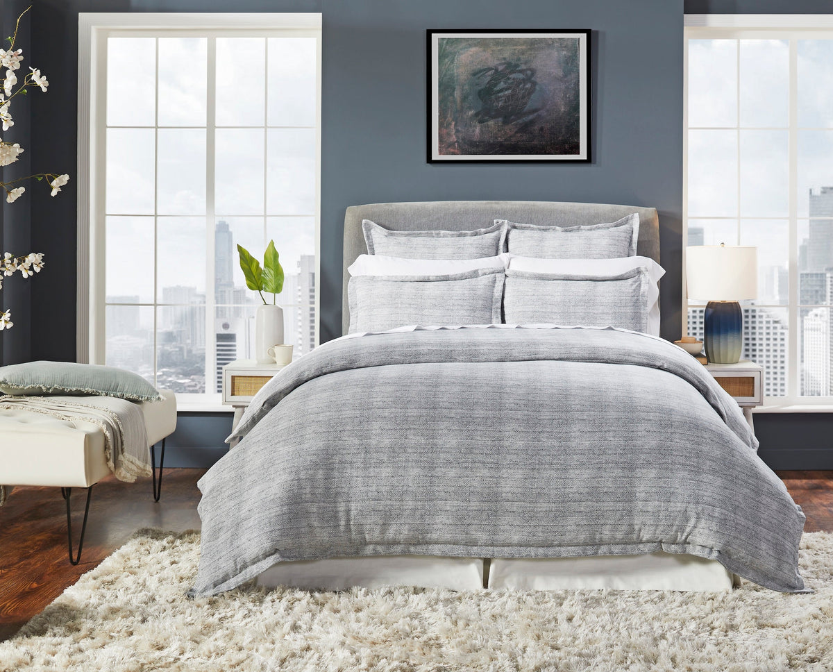 DT-035-9092_1|Sophisticated gray textured duvet cover set on a modern bed, enhancing a chic urban bedroom with large windows.