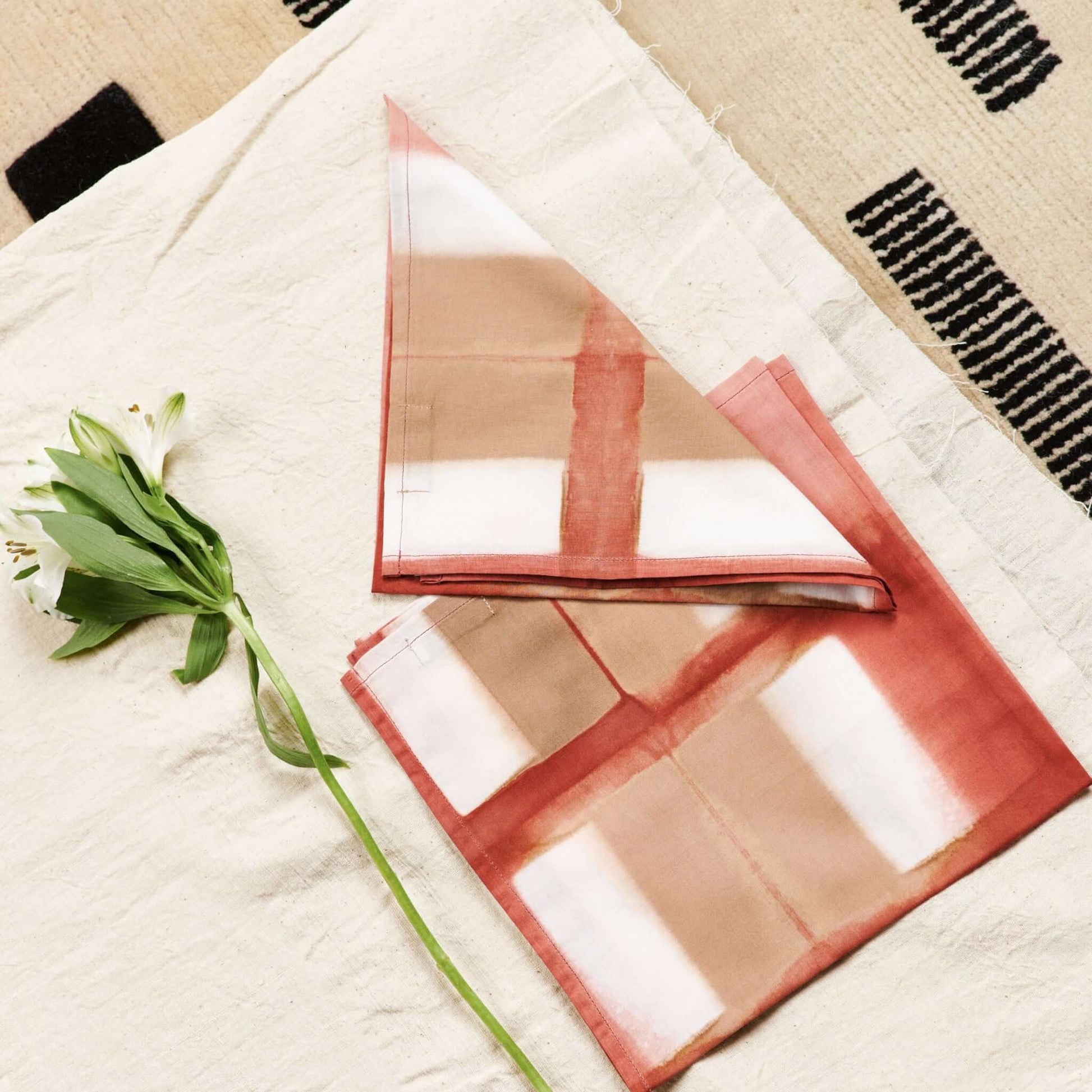 Chowk Red Print Cotton Artisanal Table Napkin Set featuring natural dye technique and elegant design.