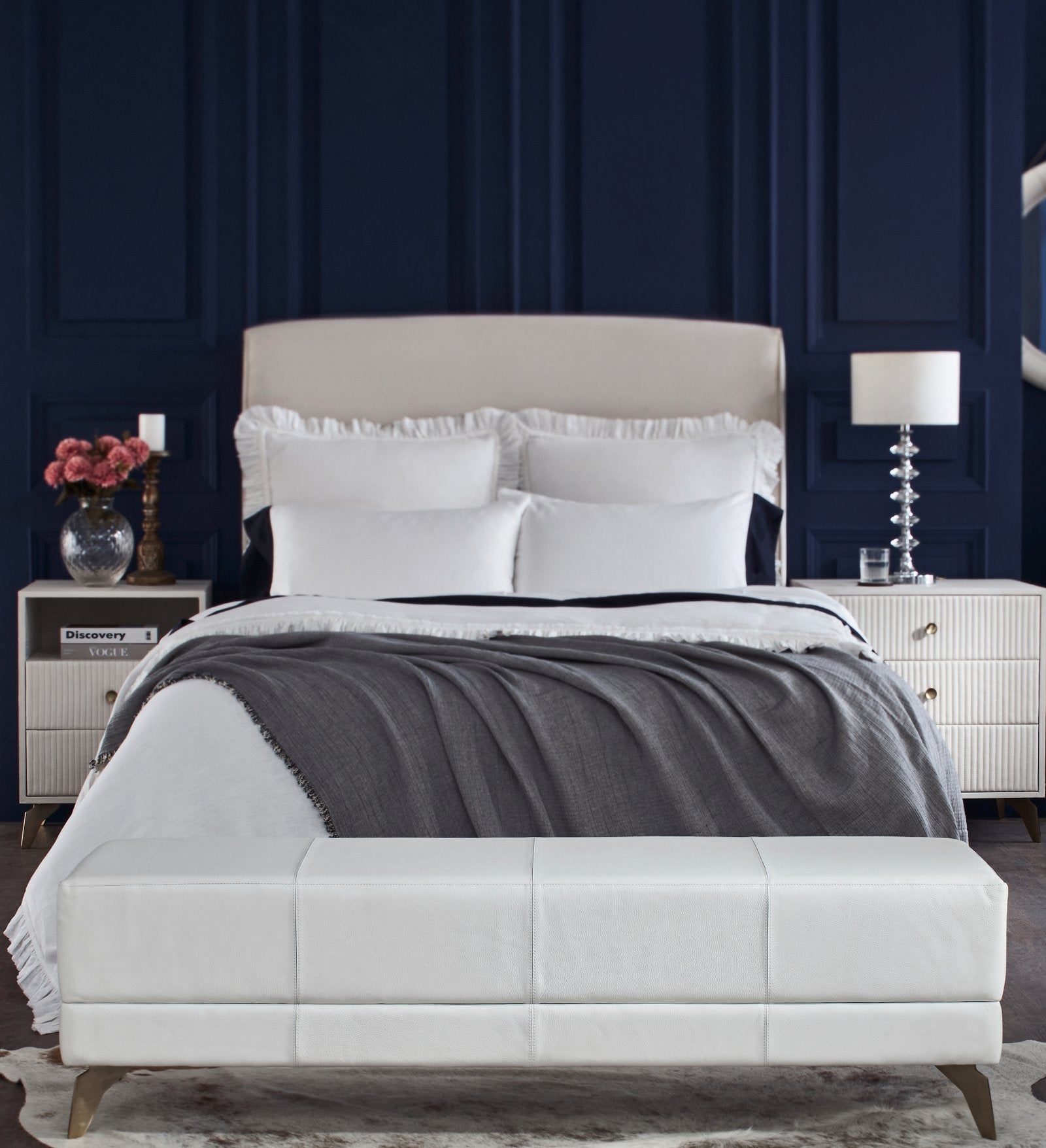FN-5201-601618_2|Luxurious white leather upholstered bench at the foot of a bed, adding stylish seating and a modern elegant touch to bedrooms.