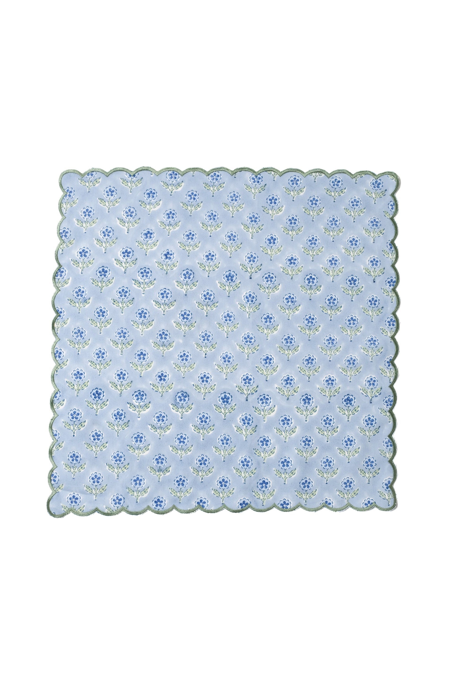 Blue scallop-edged napkin with blockprint flower pattern