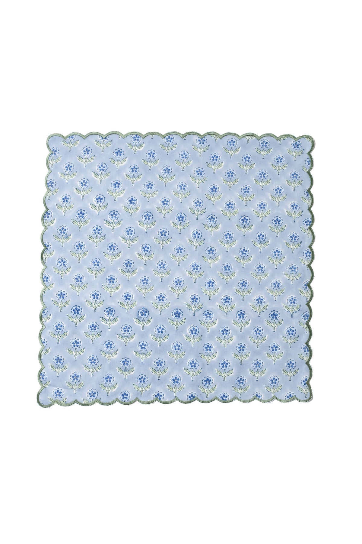 Blue scallop-edged napkin with blockprint flower pattern