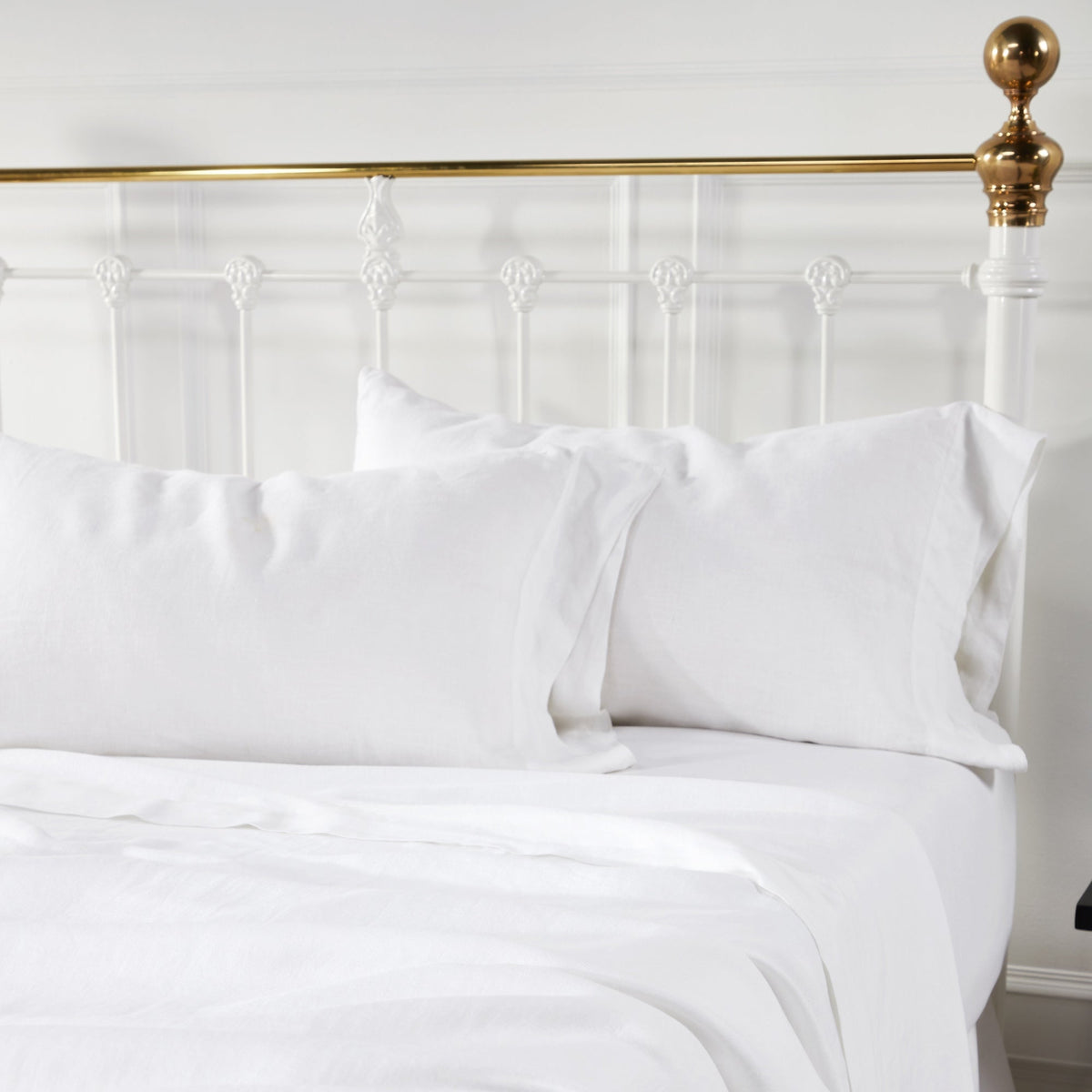 KSS-514-7880_3|Close-up of soft white 100% pure linen sheet set and pillowcases on a bed. Comfortable and breathable natural bedding.