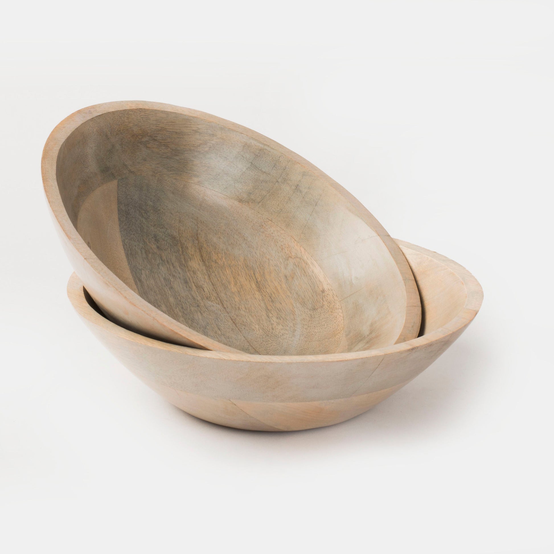 Overhead view of a round handcrafted mango wood bowl in grey, perfect for serving snacks or side dishes.