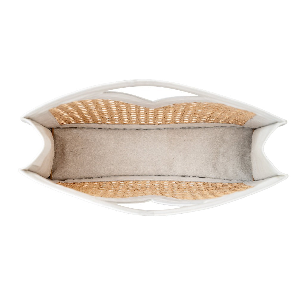 Side profile white leather and cane webbing rattan top handle tote handbag