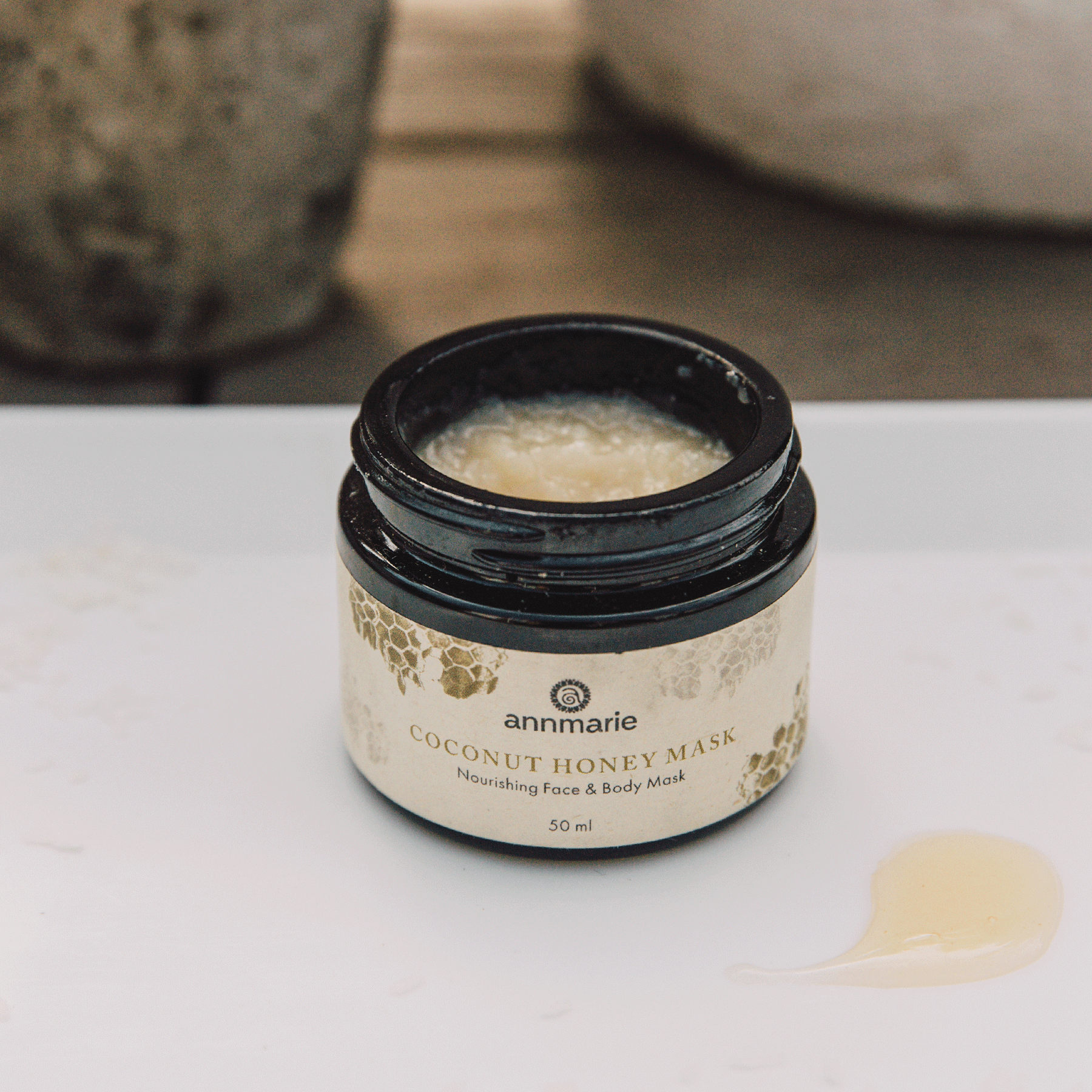 Coconut Honey Mask nourishing face and body mask in open 50 ml jar with creamy texture visible.