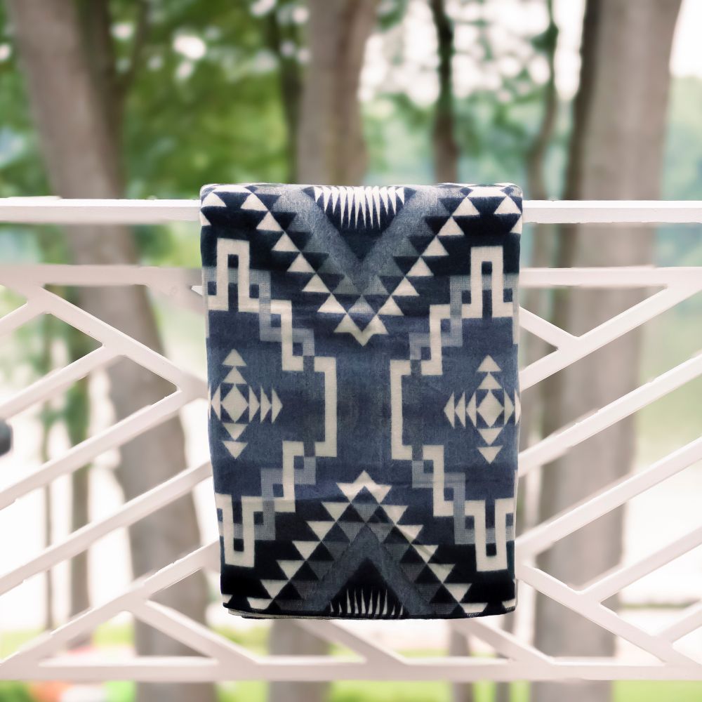 Navy artisanal woven throw with geometric design