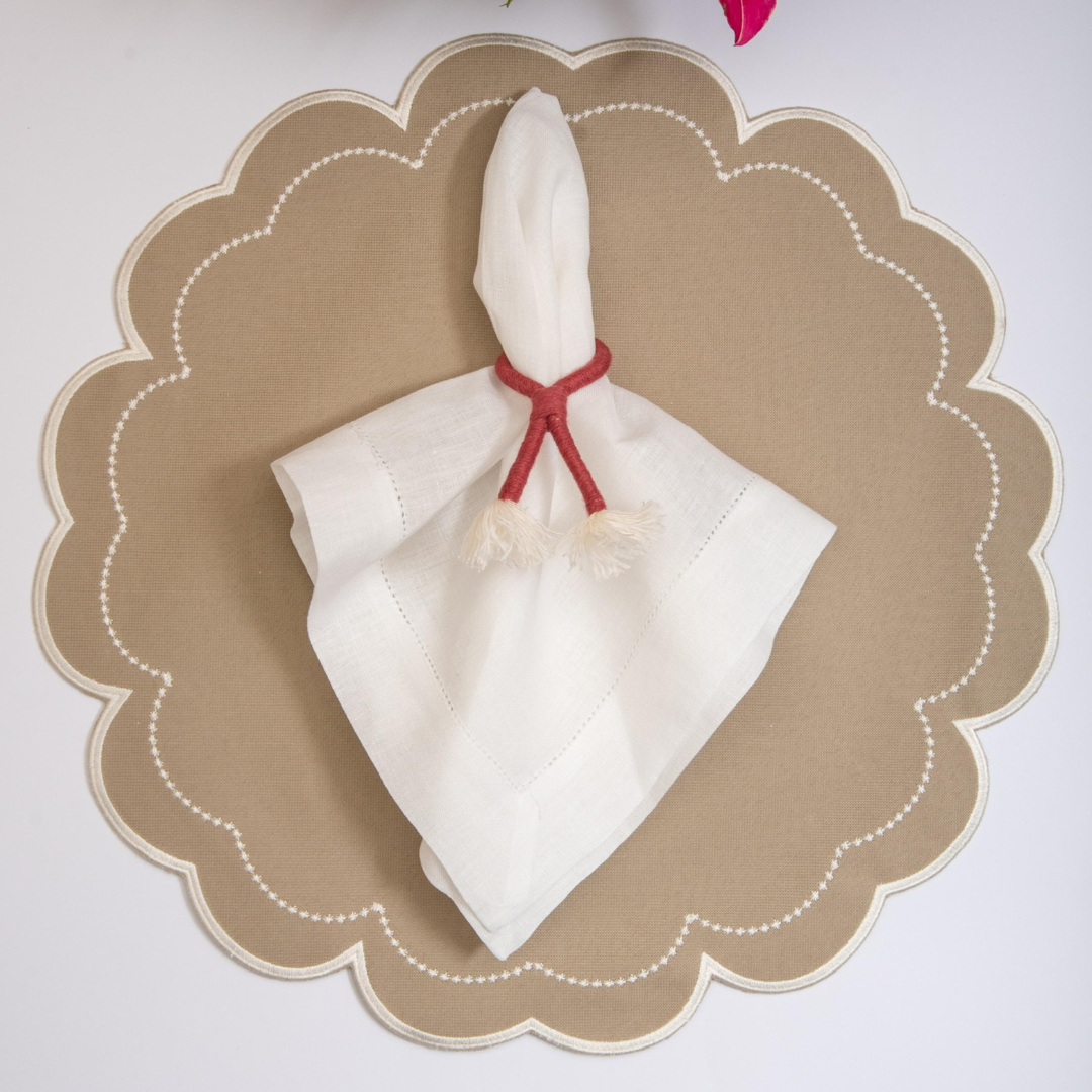 The Fendi Victoria impermeable placemat with Victorian-style border detail by Talah Home