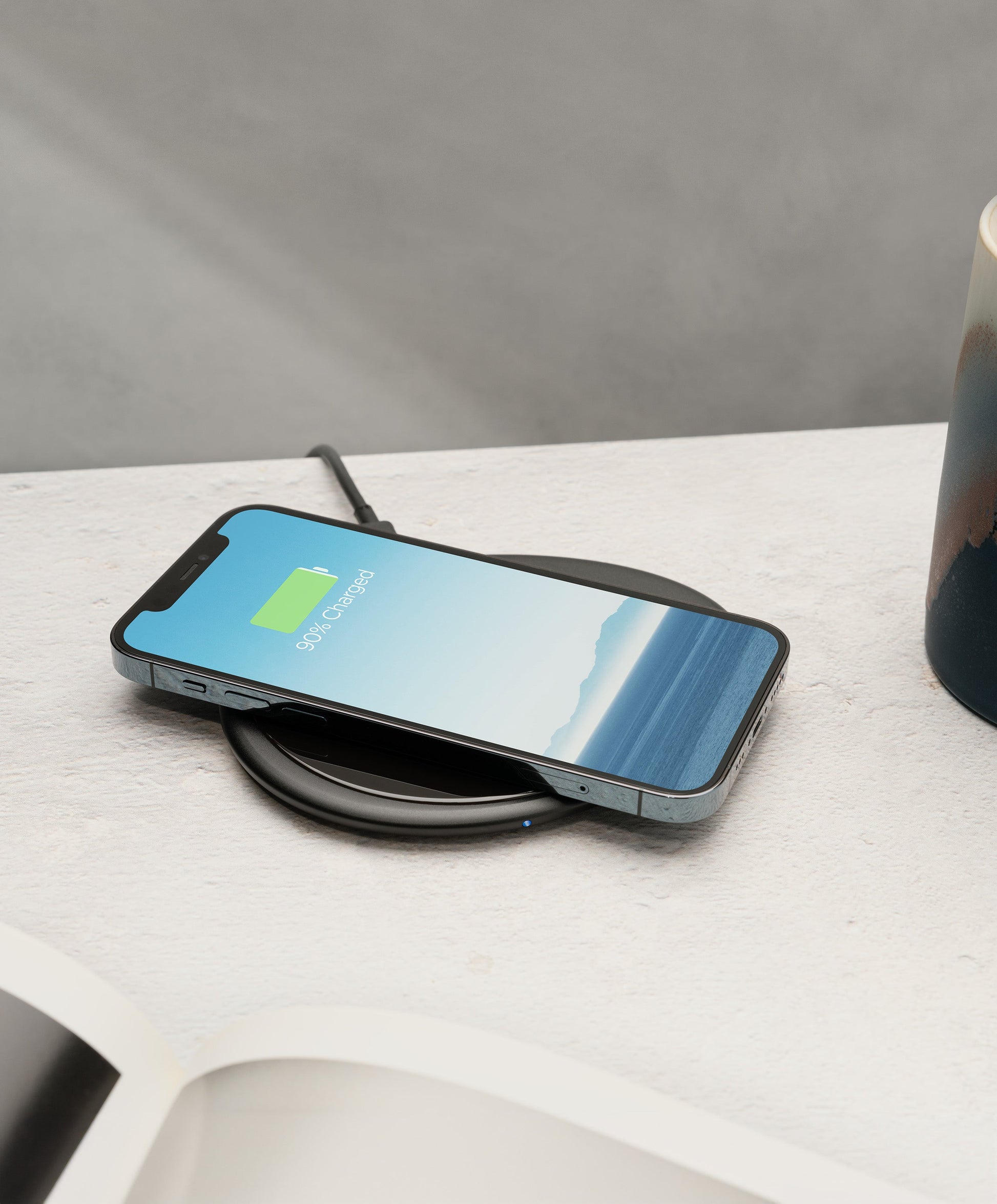 Ui Artist Collection Black OHOM Pad 3 wirelessly charging iPhone