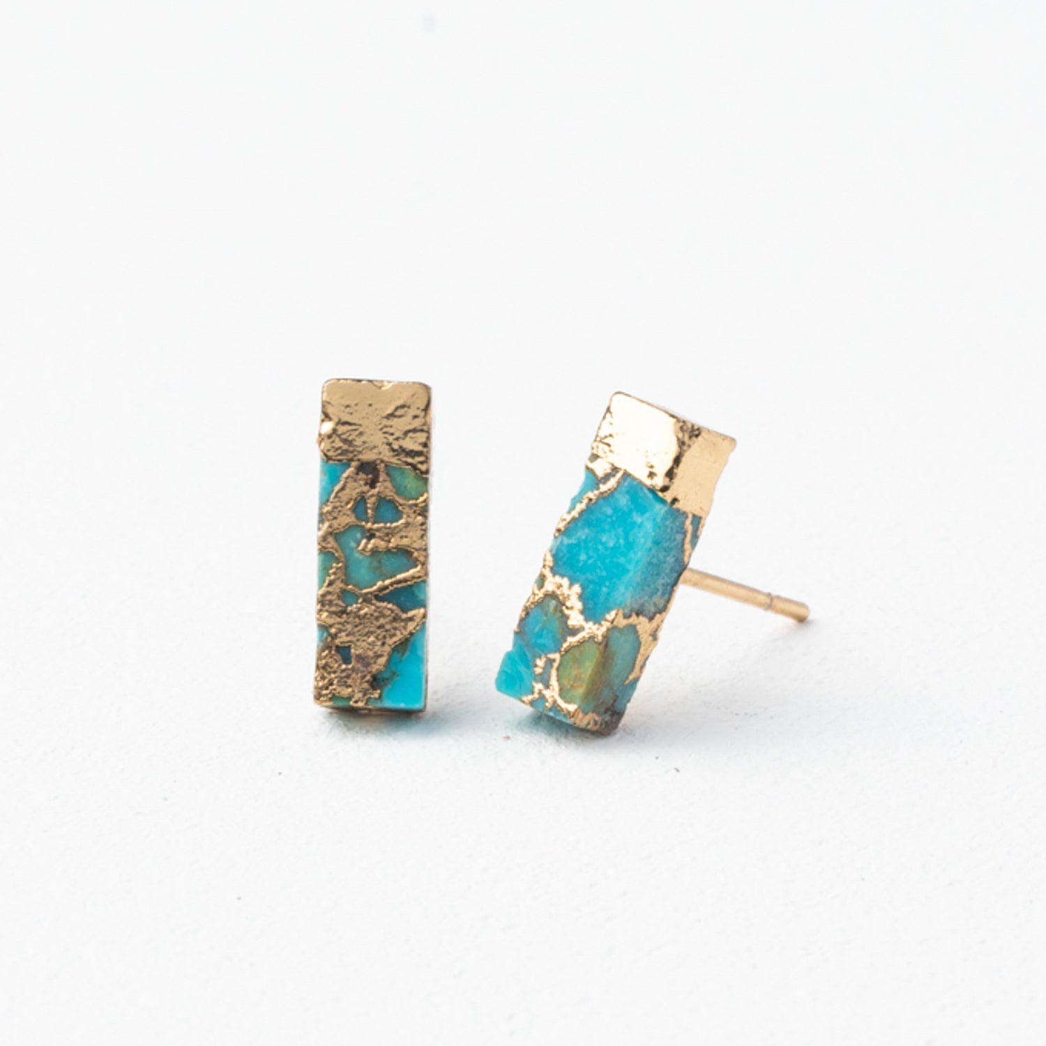 A pair of gold and turquoise studs with white background, best fair trade gifts, women's artisan jewelry, quality, adult jewelry