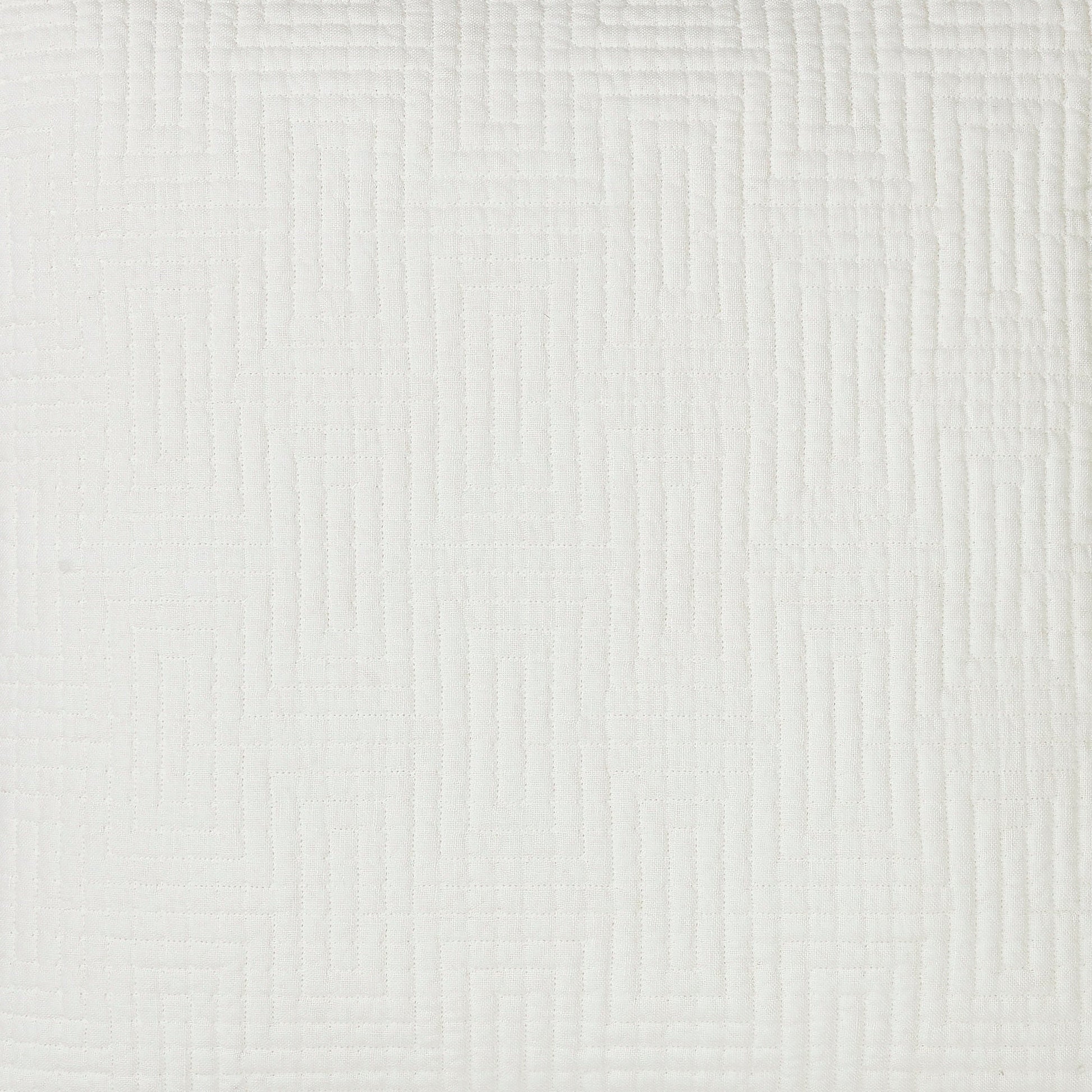CL-199-11096_8|Close-up of a white quilted coverlet fabric, highlighting the intricate geometric maze pattern and soft texture.