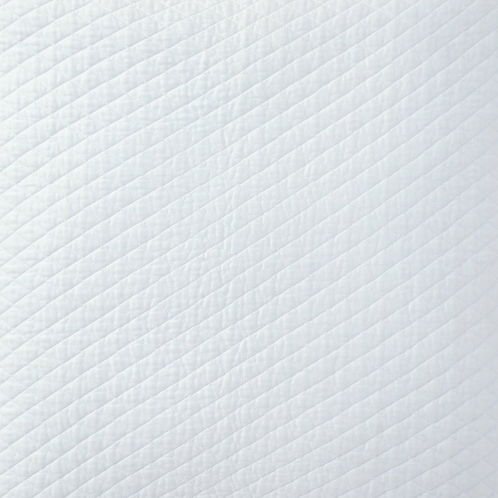 SS-264-2026_4|Crisp white quilted coverlet featuring a modern diagonal stripe pattern. Clean bedding texture for contemporary bedrooms.