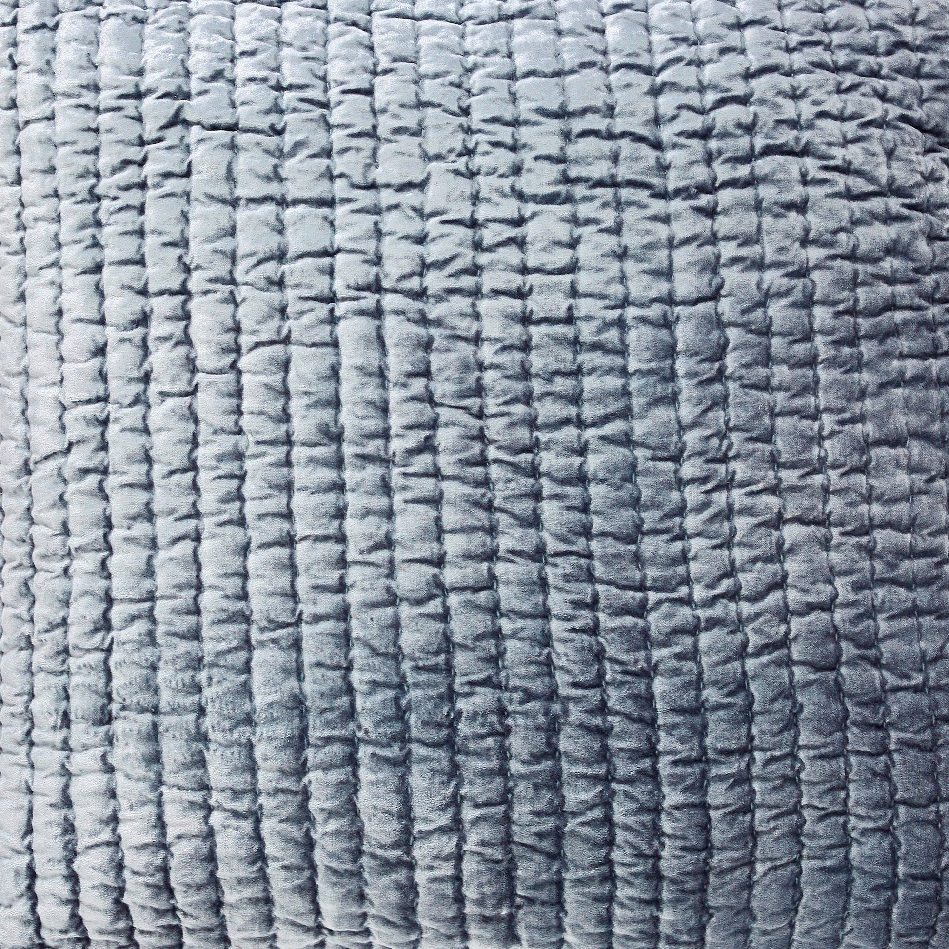 ES-340-2626-LOT1_2|Close-up of pale blue quilted fabric, showcasing a dense grid stitch pattern, ideal for modern and comfortable bedding.