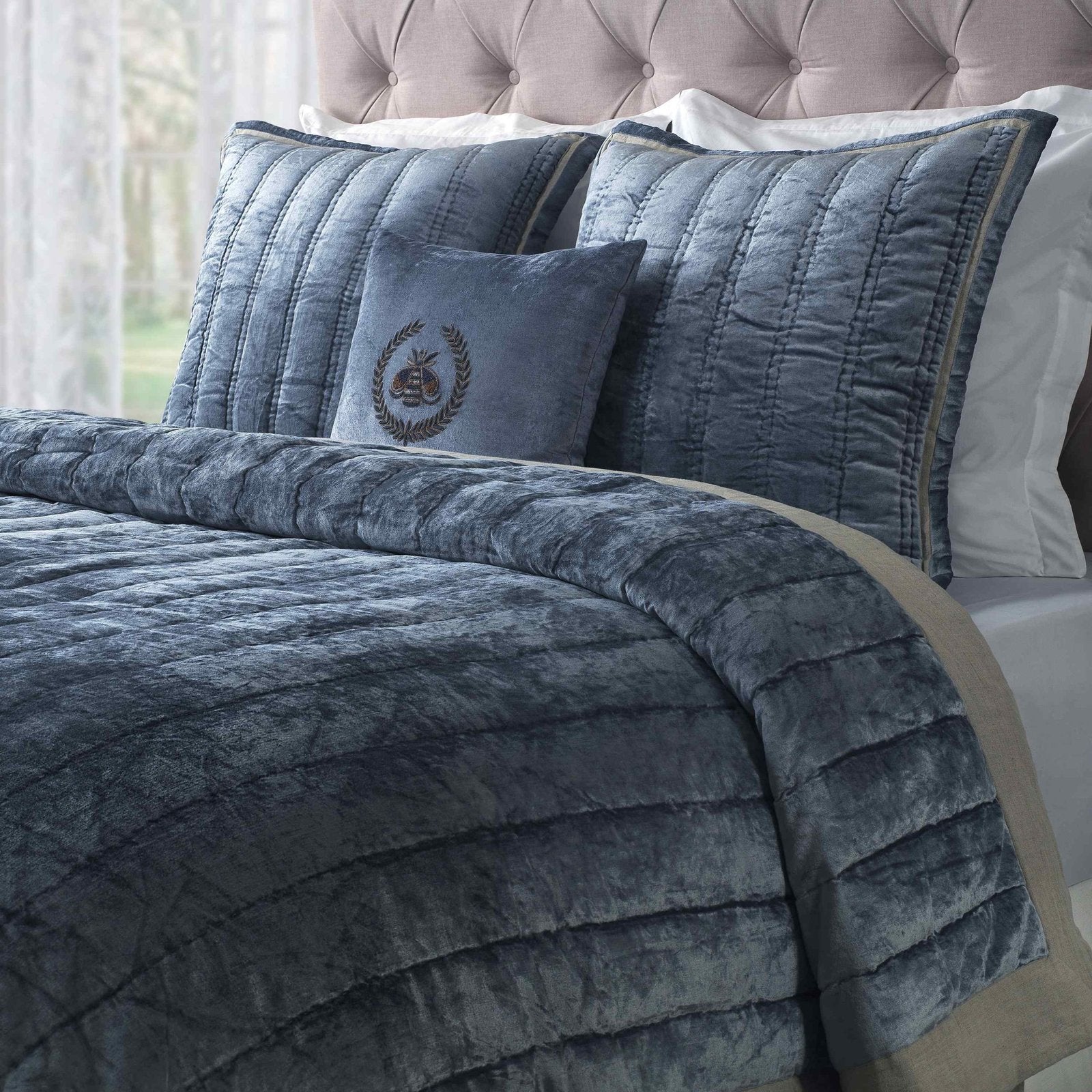 ES-308-X_1|Dark blue/grey quilted bedspread featuring vertical channel quilting and a soft velvet texture. Bedroom setting.