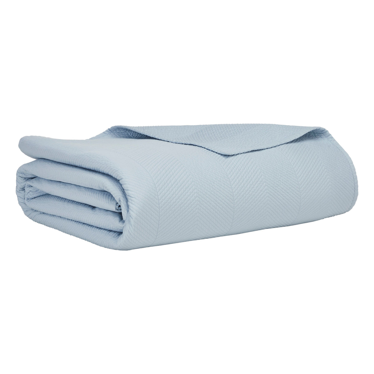 CL-262-9496_6|Light blue quilted coverlet expertly folded, highlighting its subtle herringbone pattern for elegant and comfortable bedding.
