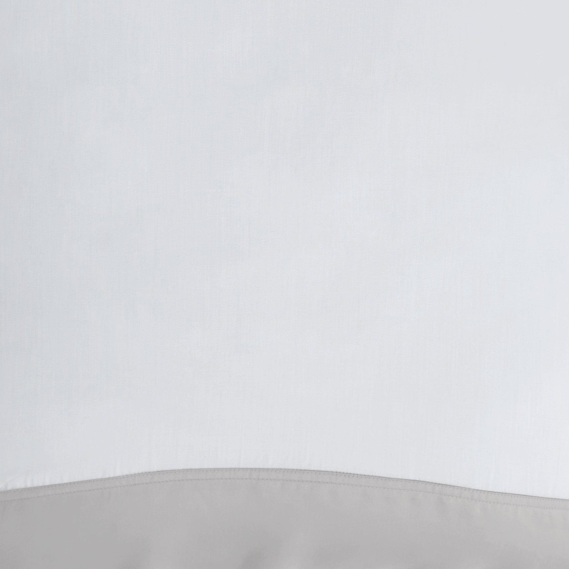 ASP-529-2032_3|Close-up of premium 100% Lyocell sheet fabric, crisp white with elegant grey border, ideal for luxurious bed linen.