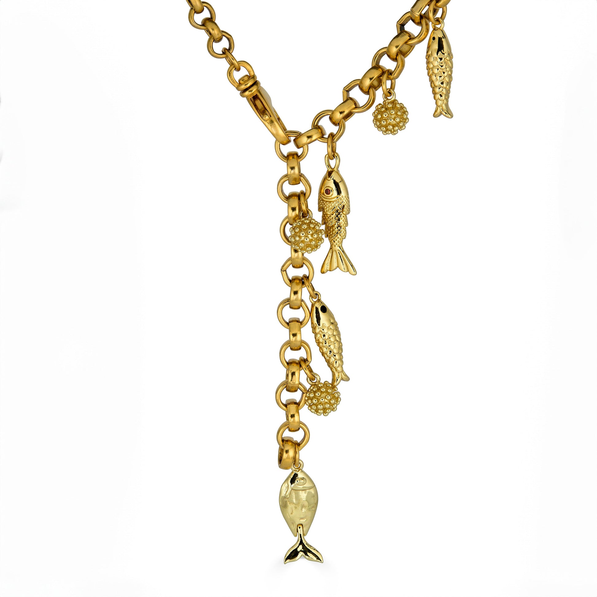 Convertible gold fish charm necklace with dangling fish and textured bead charms worn as both a lariat and classic chain necklace.
