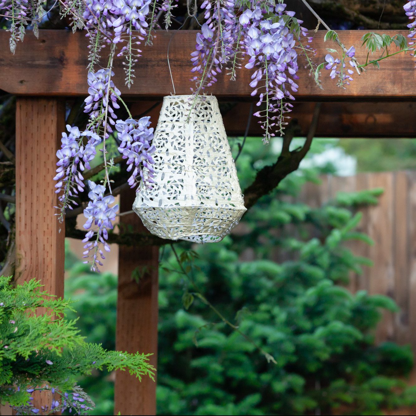 Soji Stella Prism Tyvek Solar Lantern in backyard