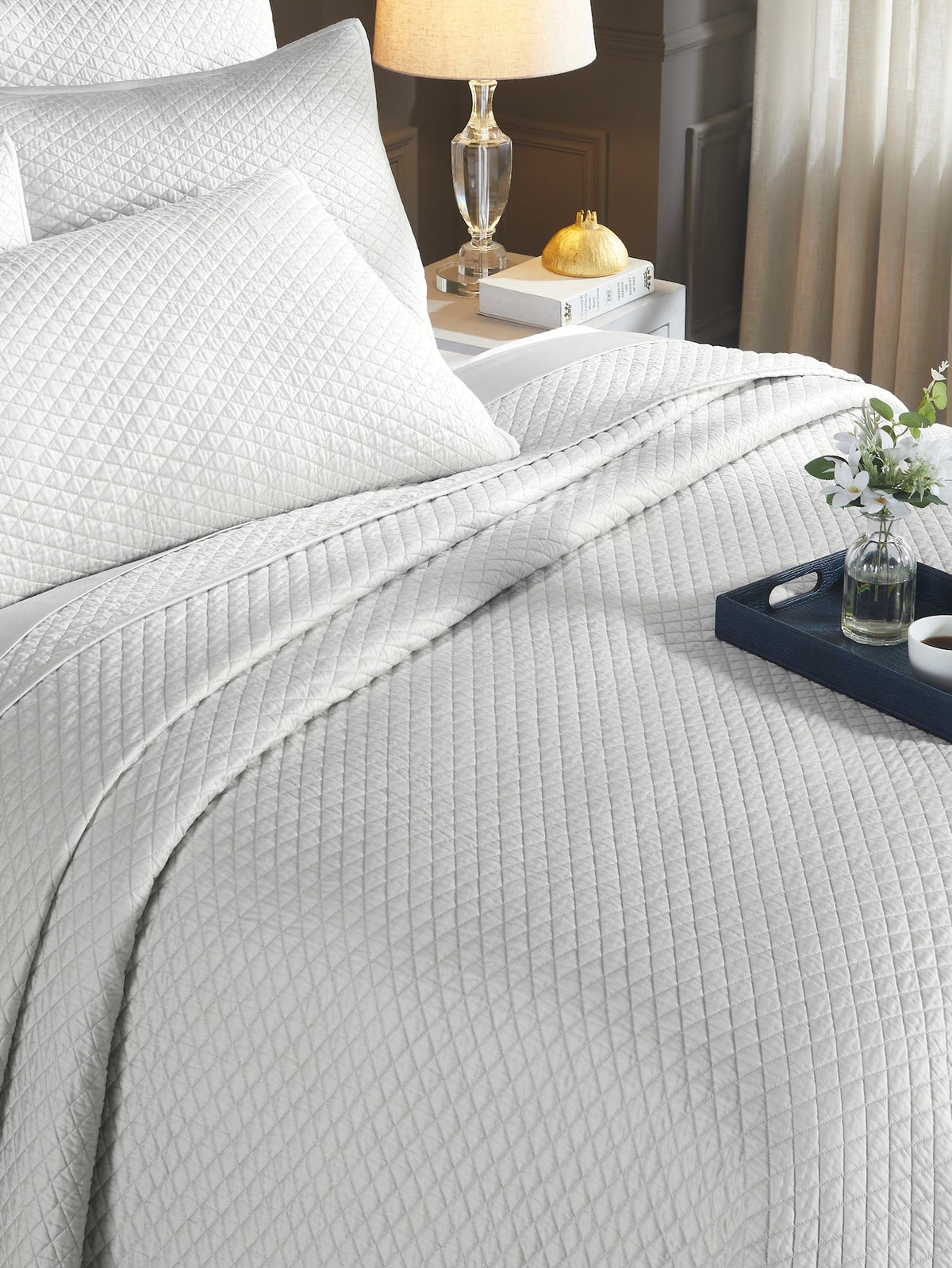 CL-266-11096_4|Cozy light gray diamond quilted coverlet on a bed, highlighting its soft texture. Elegant and comfortable bedding for a relaxed bedroom.
