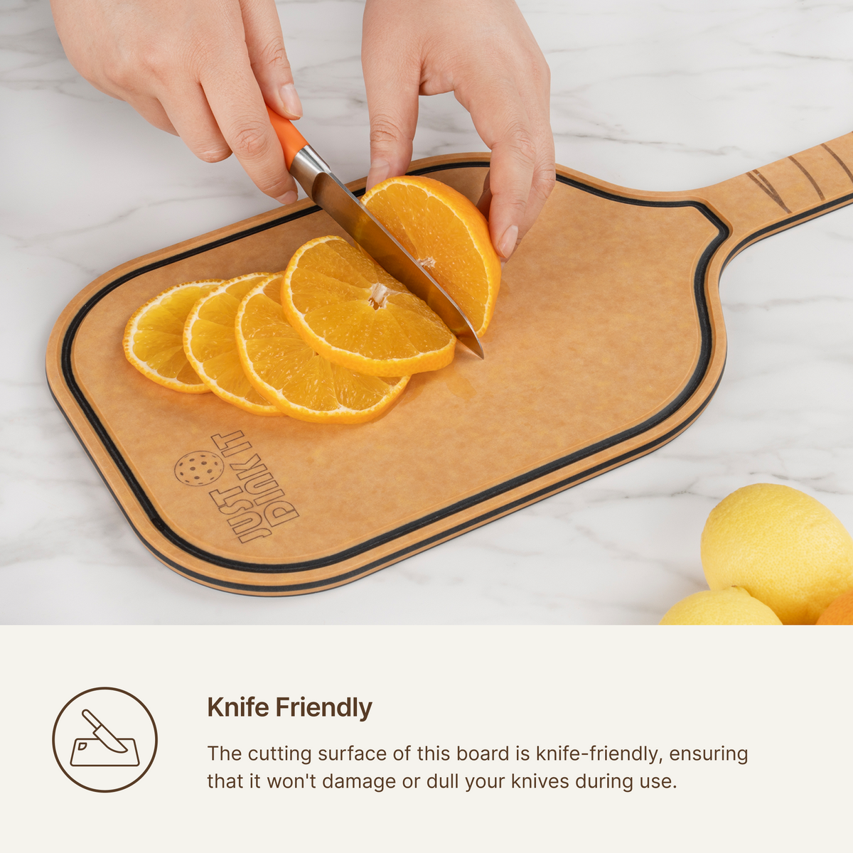 Orange slices being cut on an Elihome pickleball paddle cutting board, knife-friendly surface that will not dull blades