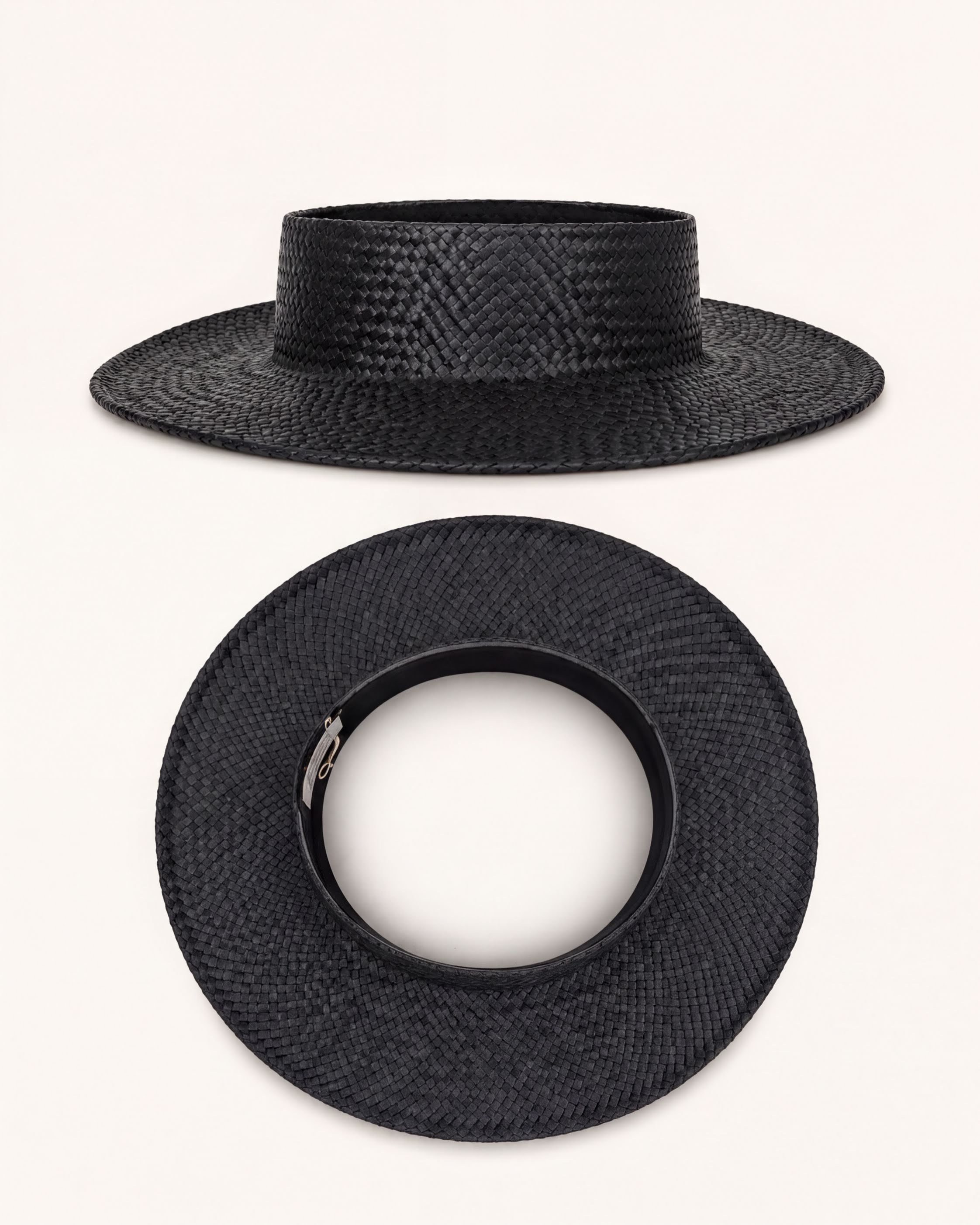 a black straw hat with a round brim and a silver buckle.