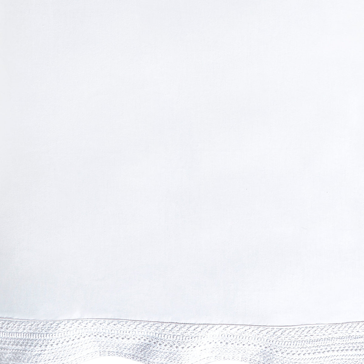 CSS-520-7284_6|Detail of soft white 100% cotton sheet fabric, highlighting an elegant and intricate crocheted border design.