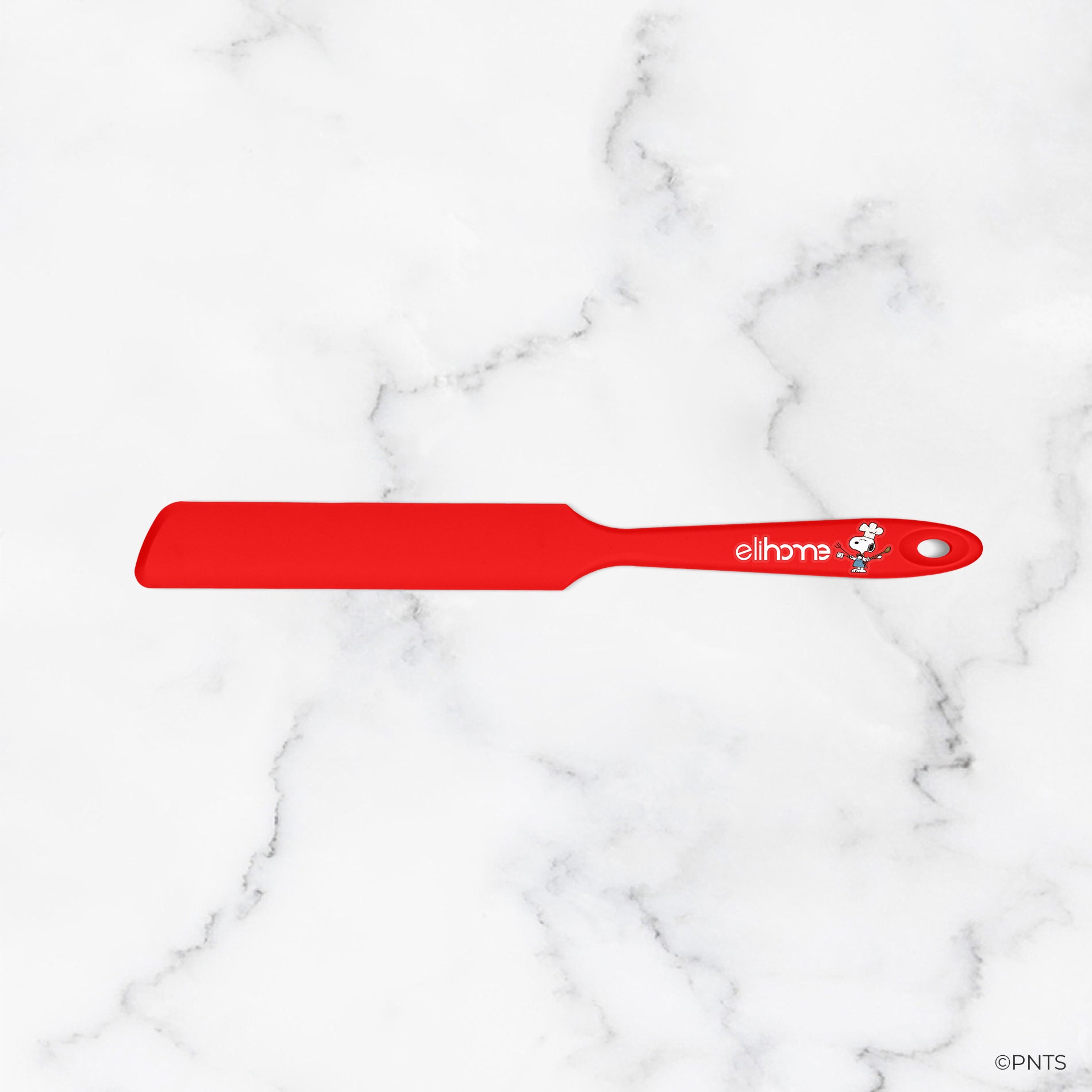 Red spatula with 'elithe' branding on a white marble background